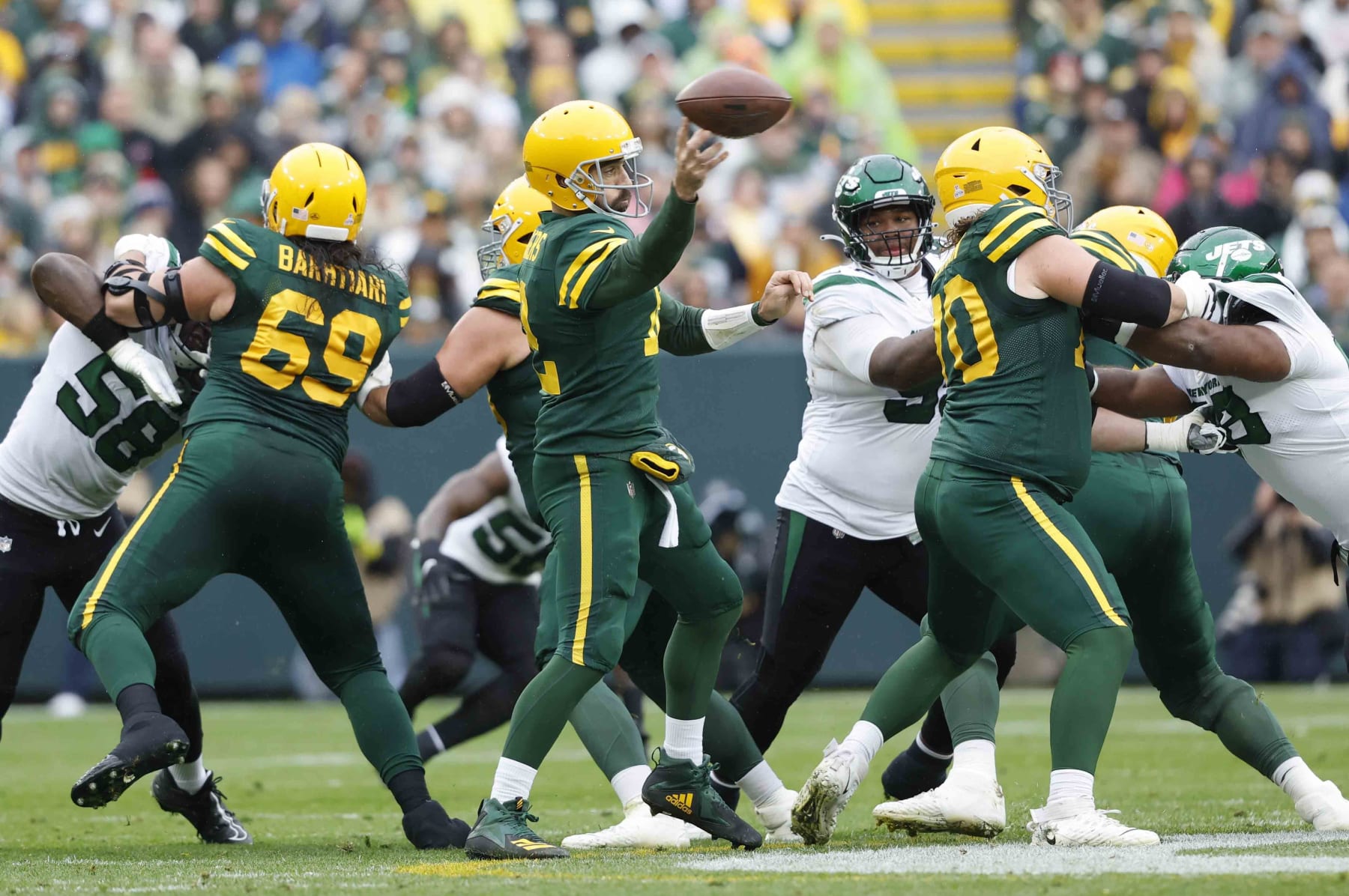 Green Bay Packers quarterback Aaron Rodgers (12) throws the ball against the New York Jets during an NFL game Sunday, Oct. 16, 2022, in Green Bay, Wis. (AP Photo/Jeffrey Phelps)