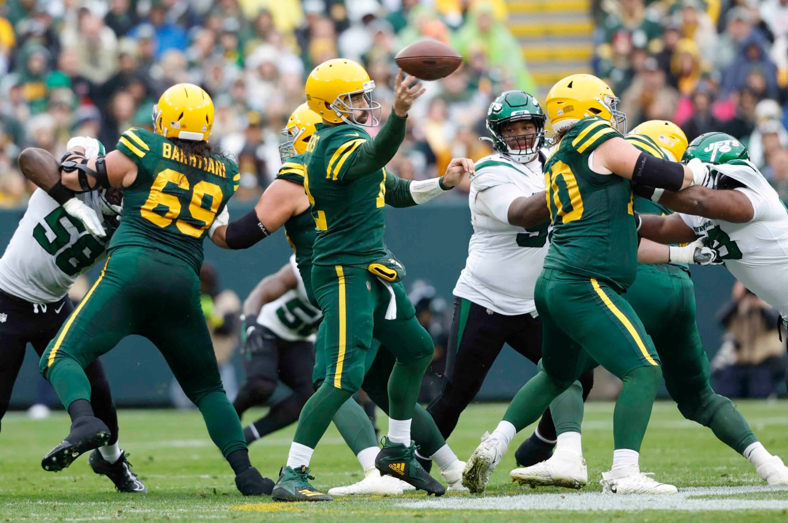 Green Bay Packers quarterback Aaron Rodgers (12) throws the ball against the New York Jets during an NFL game Sunday, Oct. 16, 2022, in Green Bay, Wis. (AP Photo/Jeffrey Phelps)