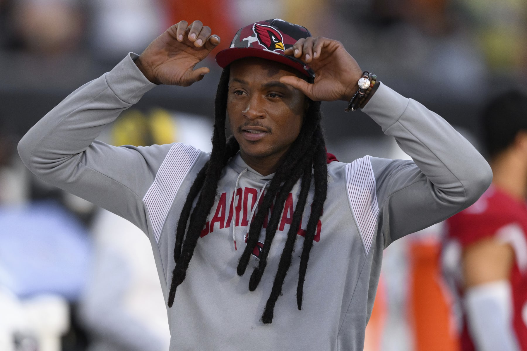 Arizona Cardinals wide receiver DeAndre Hopkins (10) stands on the sidelines before an NFL football game against the Cincinnati Bengals, Friday, Aug. 12, 2022, in Cincinnati. (AP Photo/Zach Bolinger)