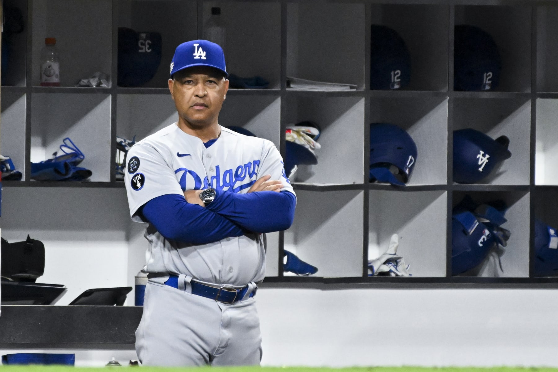 San Diego, CA - October 14: Los Angeles Dodgers manager Dave Roberts watches from the dugout in game 3 of the NLDS against the San Diego Padres at Petco Park on Friday, Oct. 14, 2022 in San Diego, CA. The Padres won 2-1. (Wally Skalij / Los Angeles Times via Getty Images)