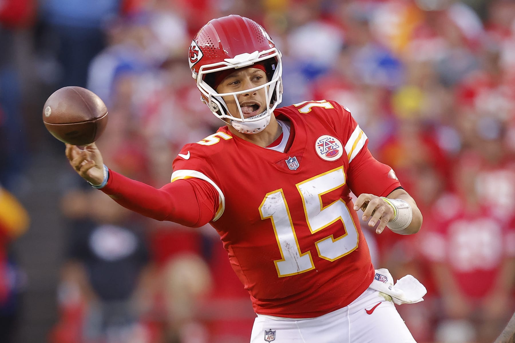 KANSAS CITY, MISSOURI - OCTOBER 16: Patrick Mahomes #15 of the Kansas City Chiefs throws the ball during the fourth quarter against the Buffalo Bills at Arrowhead Stadium on October 16, 2022 in Kansas City, Missouri. (Photo by David Eulitt/Getty Images)