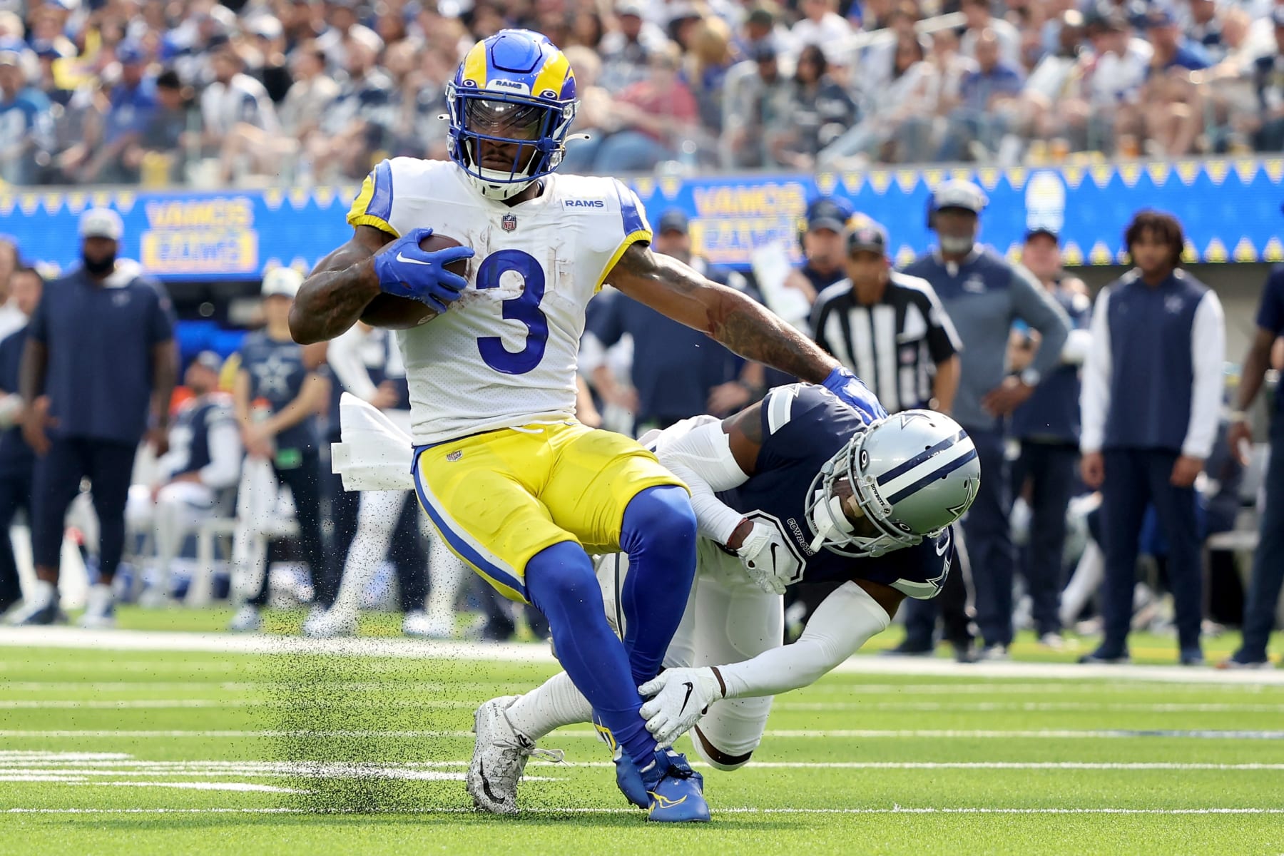 INGLEWOOD, CALIFORNIA - OCTOBER 09: Cam Akers #3 of the Los Angeles Rams breaks a tackle by Jourdan Lewis #2 of the Dallas Cowboys during the second quarter at SoFi Stadium on October 09, 2022 in Inglewood, California. (Photo by Sean M. Haffey/Getty Images)