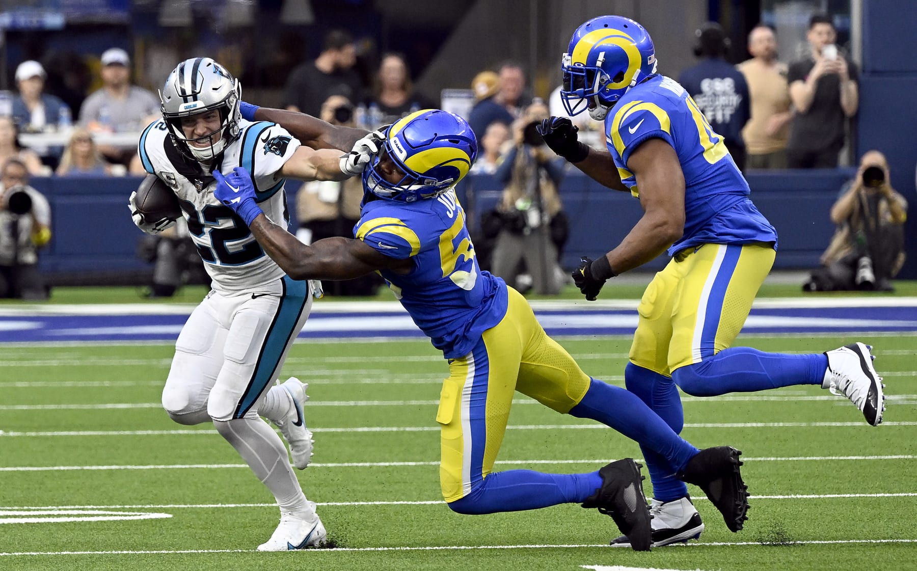 INGLEWOOD, CALIFORNIA - OCTOBER 16: Christian McCaffrey #22 of the Carolina Panthers stiff arms Ernest Jones #53 of the Los Angeles Rams during the fourth quarter at SoFi Stadium on October 16, 2022 in Inglewood, California. (Photo by John McCoy/Getty Images)