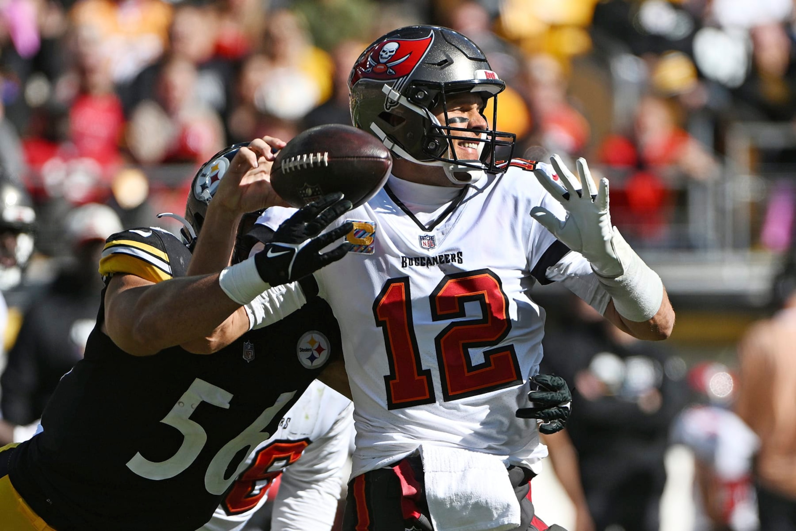 Pittsburgh Steelers linebacker Alex Highsmith (56) forces a fumble as he hits Tampa Bay Buccaneers quarterback Tom Brady (12) during the first half of an NFL football game in Pittsburgh, Sunday, Oct. 16, 2022. (AP Photo/Barry Reeger)