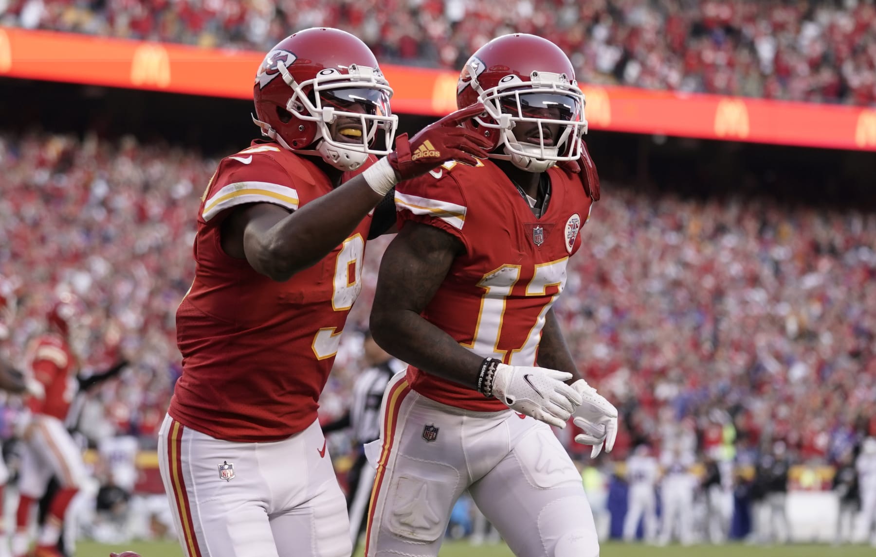 Kansas City Chiefs wide receiver Mecole Hardman (17) is congratulated by JuJu Smith-Schuster (9) after scoring a touchdown during the second half of an NFL football game against the Buffalo Bills Sunday, Oct. 16, 2022, in Kansas City, Mo. (AP Photo/Ed Zurga)