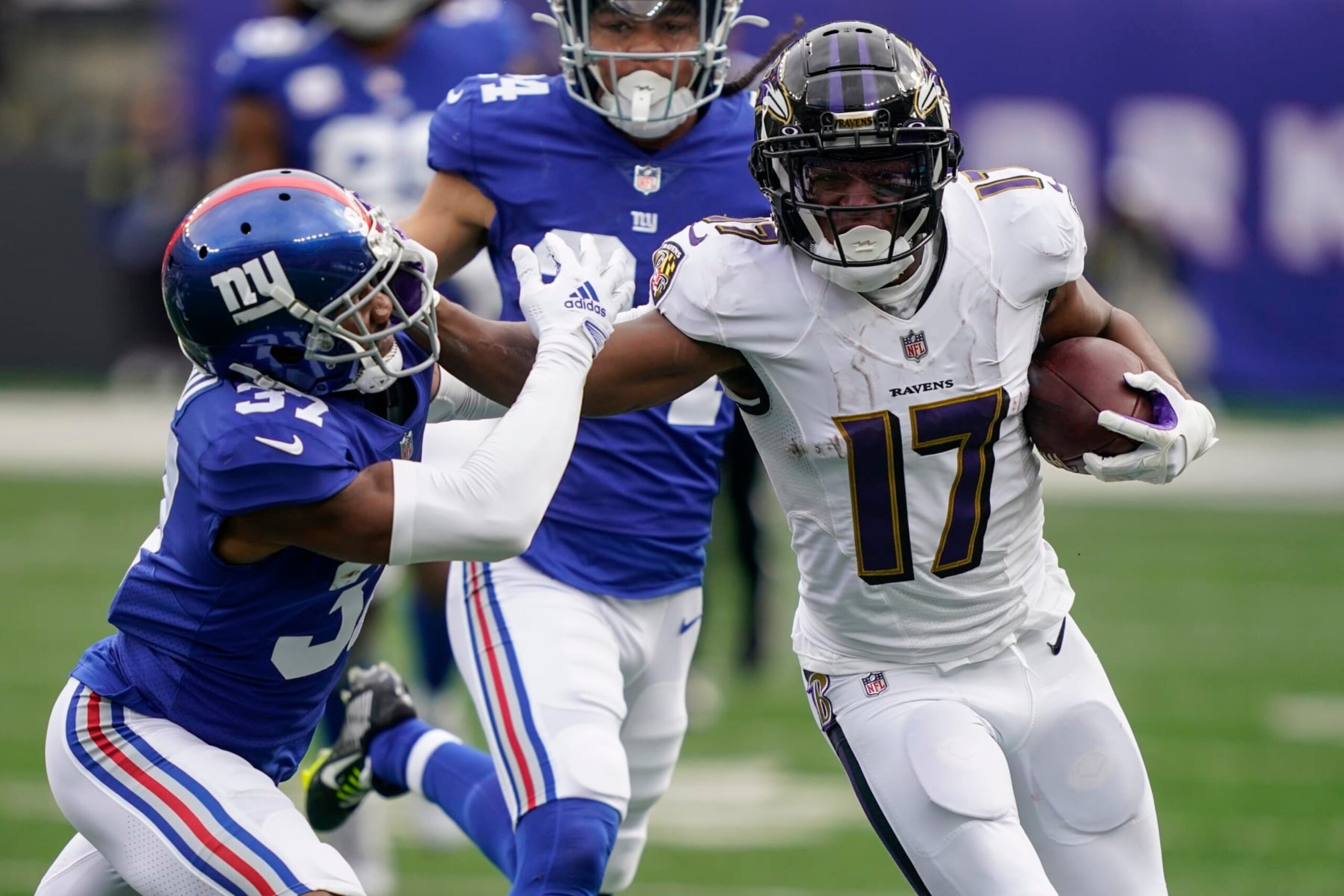 Baltimore Ravens' Kenyan Drake (17) stiff-arms New York Giants' Fabian Moreau (37) during the first half of an NFL football game Sunday, Oct. 16, 2022, in East Rutherford, N.J. (AP Photo/John Minchillo)