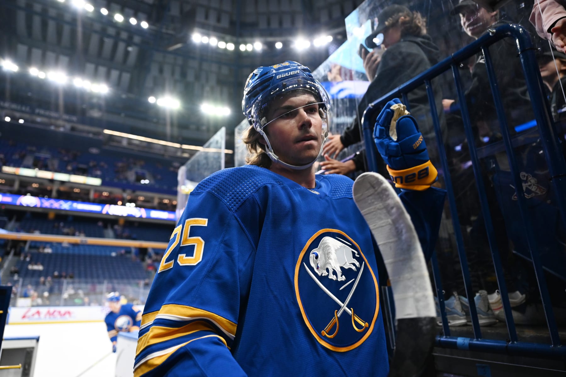 BUFFALO, NY - OCTOBER 15: Owen Power #25 of the Buffalo Sabres greets fans after warmups before an NHL game against the Florida Panthers on October 15, 2022 at KeyBank Center in Buffalo, New York. (Photo by Joe Hrycych/NHLI via Getty Images)