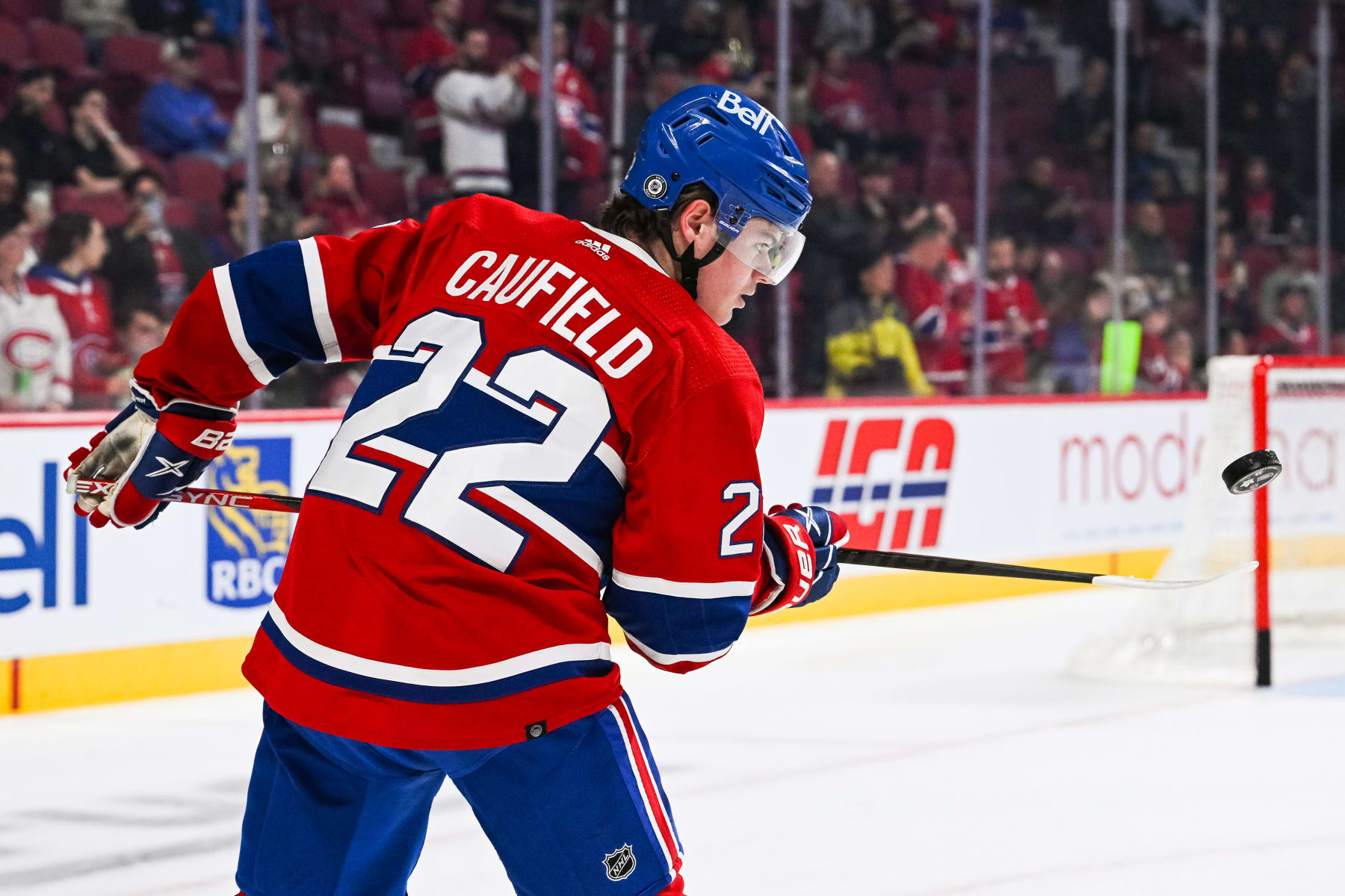 MONTREAL, QC - OCTOBER 12: Montreal Canadiens right wing Cole Caufield (22) plays with a puck before the Toronto Maple Leafs versus the Montreal Canadiens game on October 12, 2022, at Bell Centre in Montreal, QC (Photo by David Kirouac/Icon Sportswire via Getty Images)