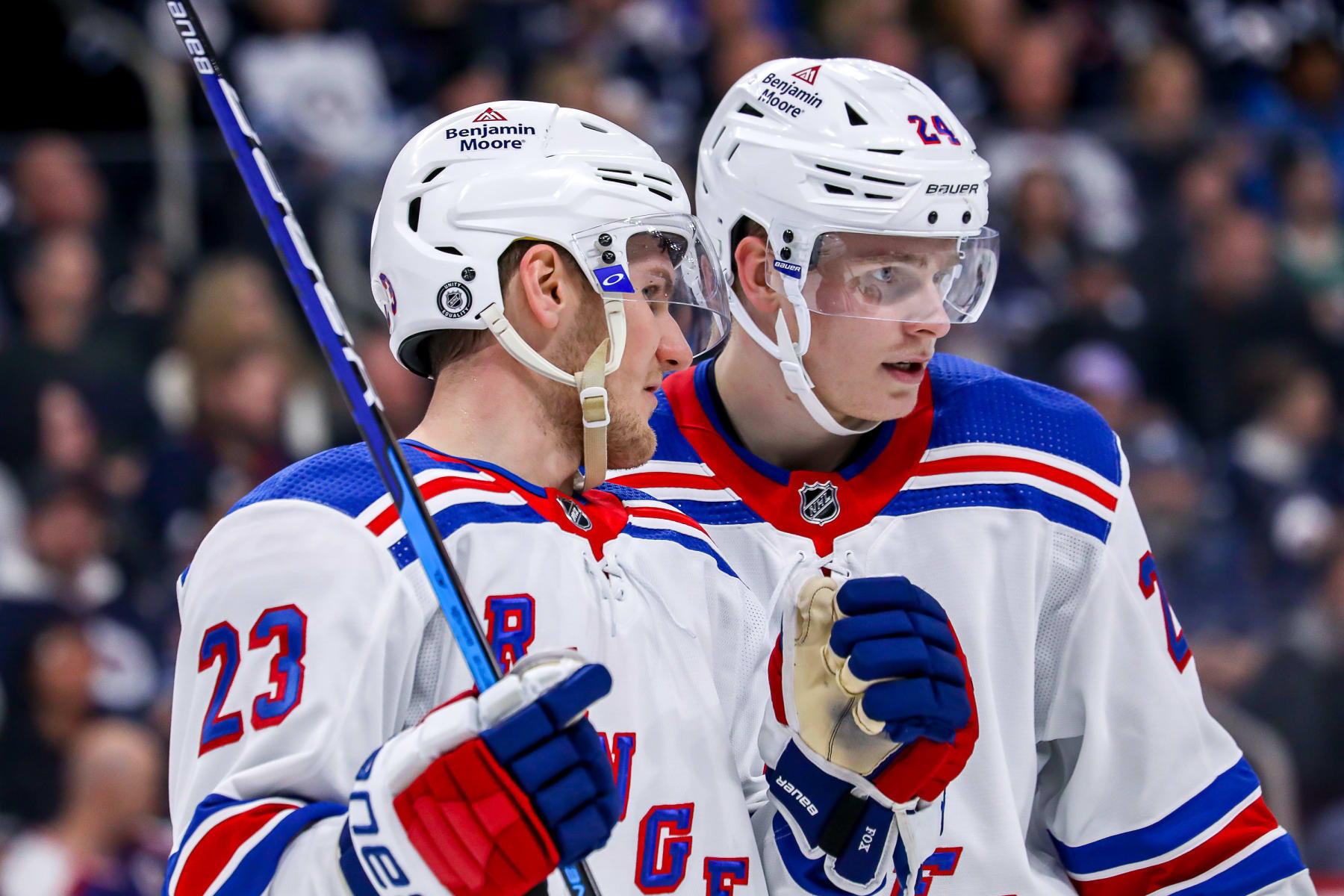 WINNIPEG, CANADA - OCTOBER 14: Adam Fox #23 and Kaapo Kakko #24 of the New York Rangers discuss strategy during a second period stoppage in play against the Winnipeg Jets at the Canada Life Centre on October 14, 2022 in Winnipeg, Manitoba, Canada. (Photo by Darcy Finley/NHLI via Getty Images)