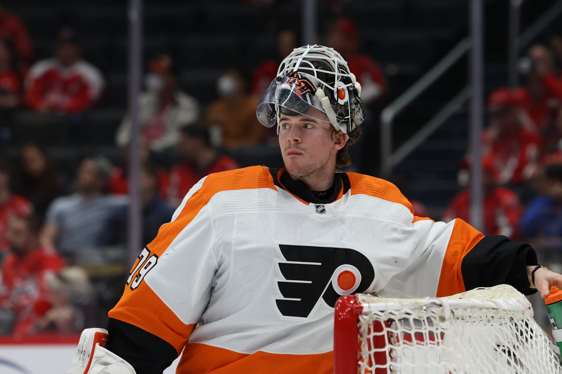 WASHINGTON, DC - APRIL 12: Carter Hart #79 of the Philadelphia Flyers takes a drink between face-offs during a game against the Washington Capitals at Capital One Arena on April 12, 2022 in Washington, D.C. (Photo by John McCreary/NHLI via Getty Images)
