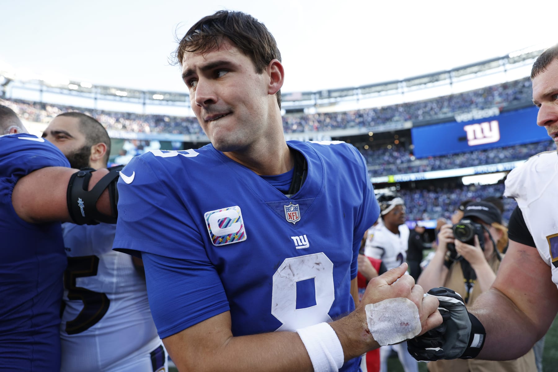 EAST RUTHERFORD, NEW JERSEY - OCTOBER 16: Daniel Jones #8 of the New York Giants reacts as he walks off the field after defeating the Baltimore Ravens 24-20 at MetLife Stadium on October 16, 2022 in East Rutherford, New Jersey. (Photo by Sarah Stier/Getty Images)