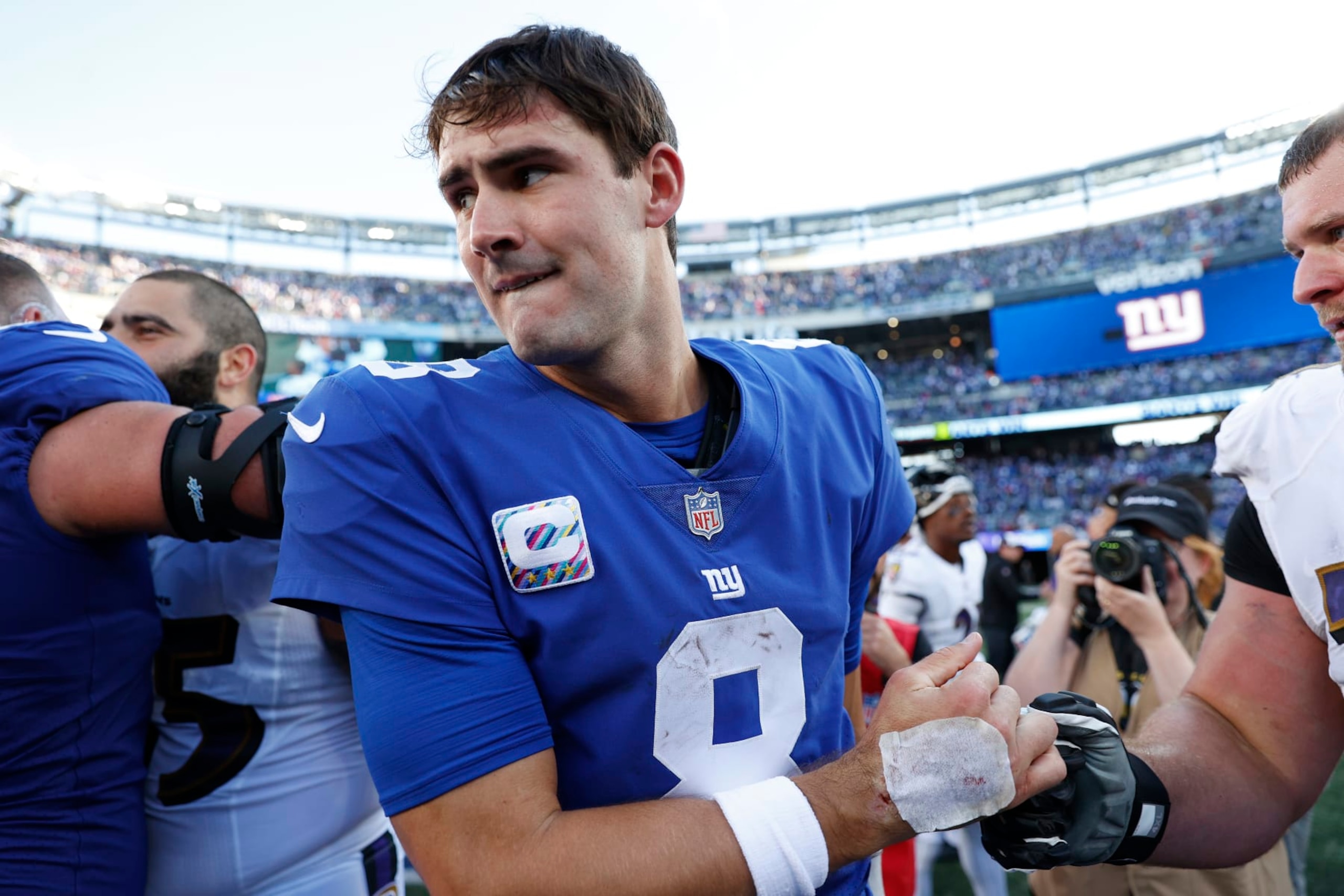 EAST RUTHERFORD, NEW JERSEY - OCTOBER 16: Daniel Jones #8 of the New York Giants reacts as he walks off the field after defeating the Baltimore Ravens 24-20 at MetLife Stadium on October 16, 2022 in East Rutherford, New Jersey. (Photo by Sarah Stier/Getty Images)