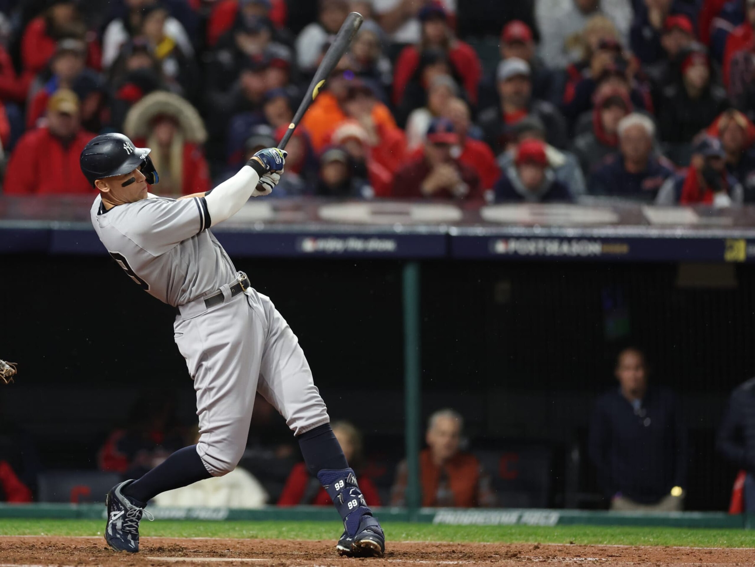 CLEVELAND, OHIO - OCTOBER 16: Aaron Judge #99 of the New York Yankees hits a single against the Cleveland Guardians during the sixth inning in game four of the American League Division Series at Progressive Field on October 16, 2022 in Cleveland, Ohio. (Photo by Christian Petersen/Getty Images)
