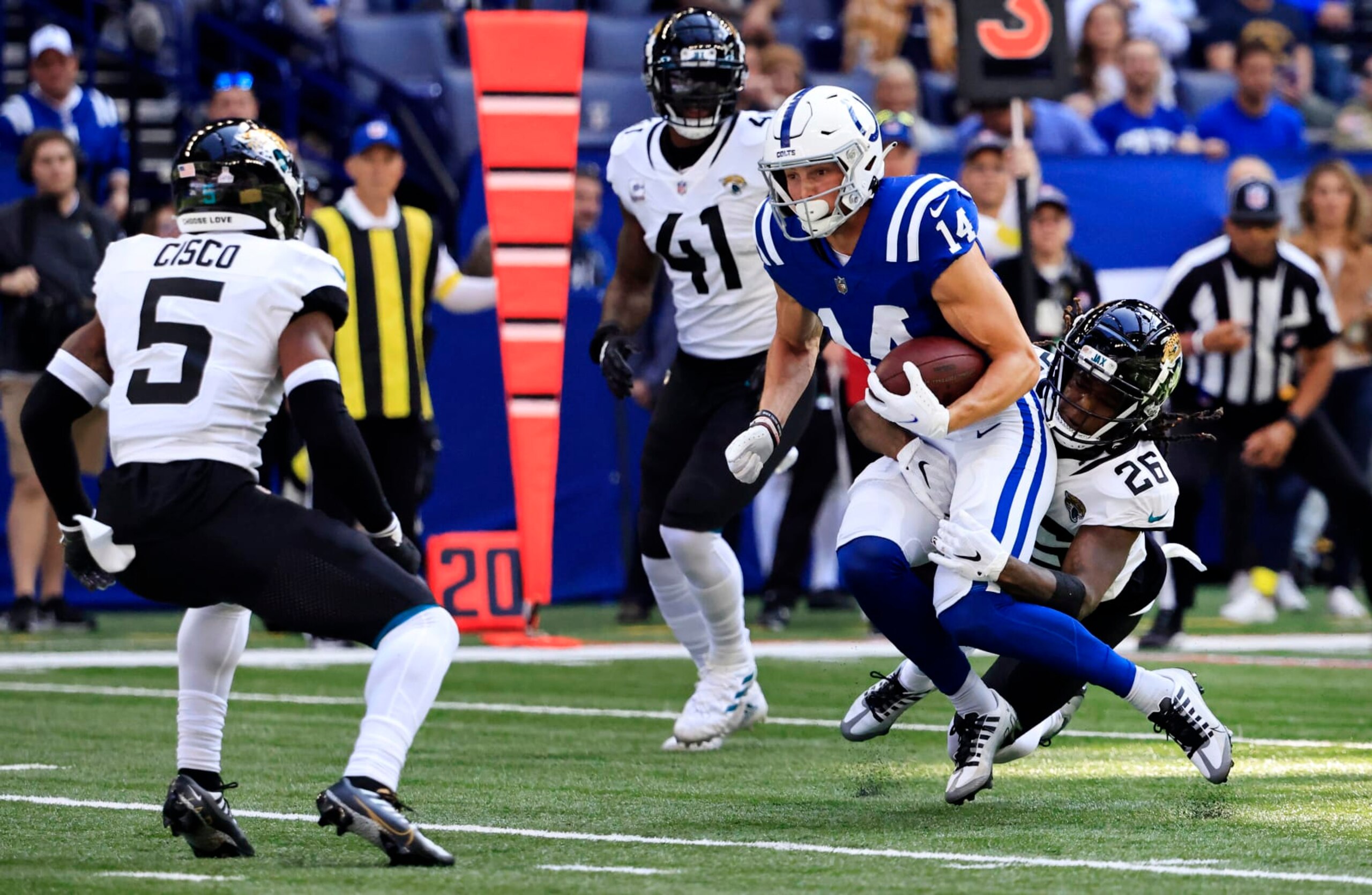 INDIANAPOLIS, INDIANA - OCTOBER 16: Alec Pierce #14 of the Indianapolis Colts is tackled by Shaquill Griffin #26 of the Jacksonville Jaguars during the second quarter at Lucas Oil Stadium on October 16, 2022 in Indianapolis, Indiana. (Photo by Justin Casterline/Getty Images)