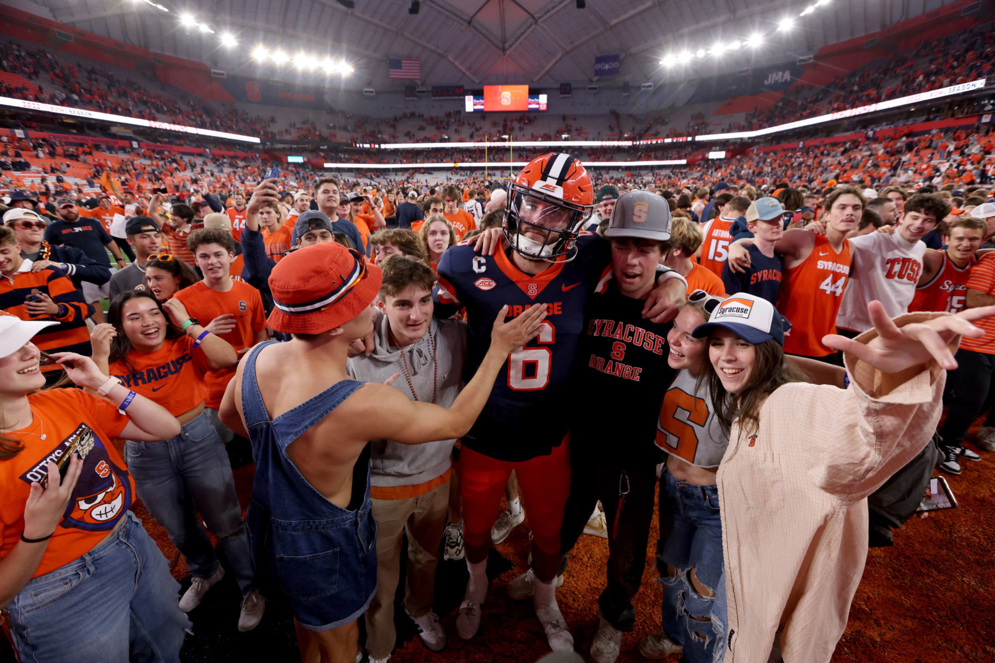 SYRACUSE, NEW YORK - OCTOBER 15: Garrett Shrader #6 of the Syracuse Orange embraces fans after a game against the North Carolina State Wolfpack at JMA Wireless Dome on October 15, 2022 in Syracuse, New York. (Photo by Bryan M. Bennett/Getty Images)