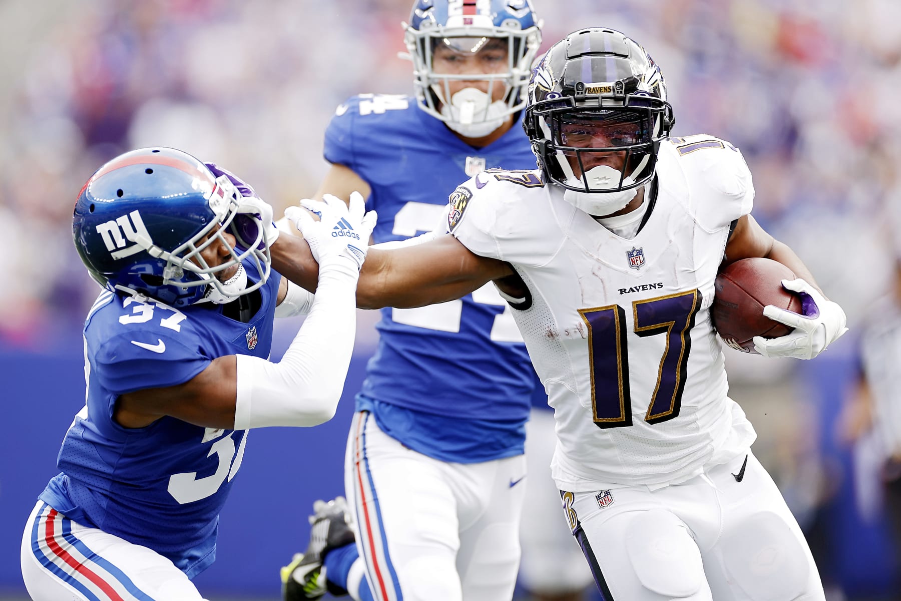EAST RUTHERFORD, NEW JERSEY - OCTOBER 16: Kenyan Drake #17 of the Baltimore Ravens runs the ball against Fabian Moreau #37 of the New York Giants during the second quarter at MetLife Stadium on October 16, 2022 in East Rutherford, New Jersey. (Photo by Sarah Stier/Getty Images)
