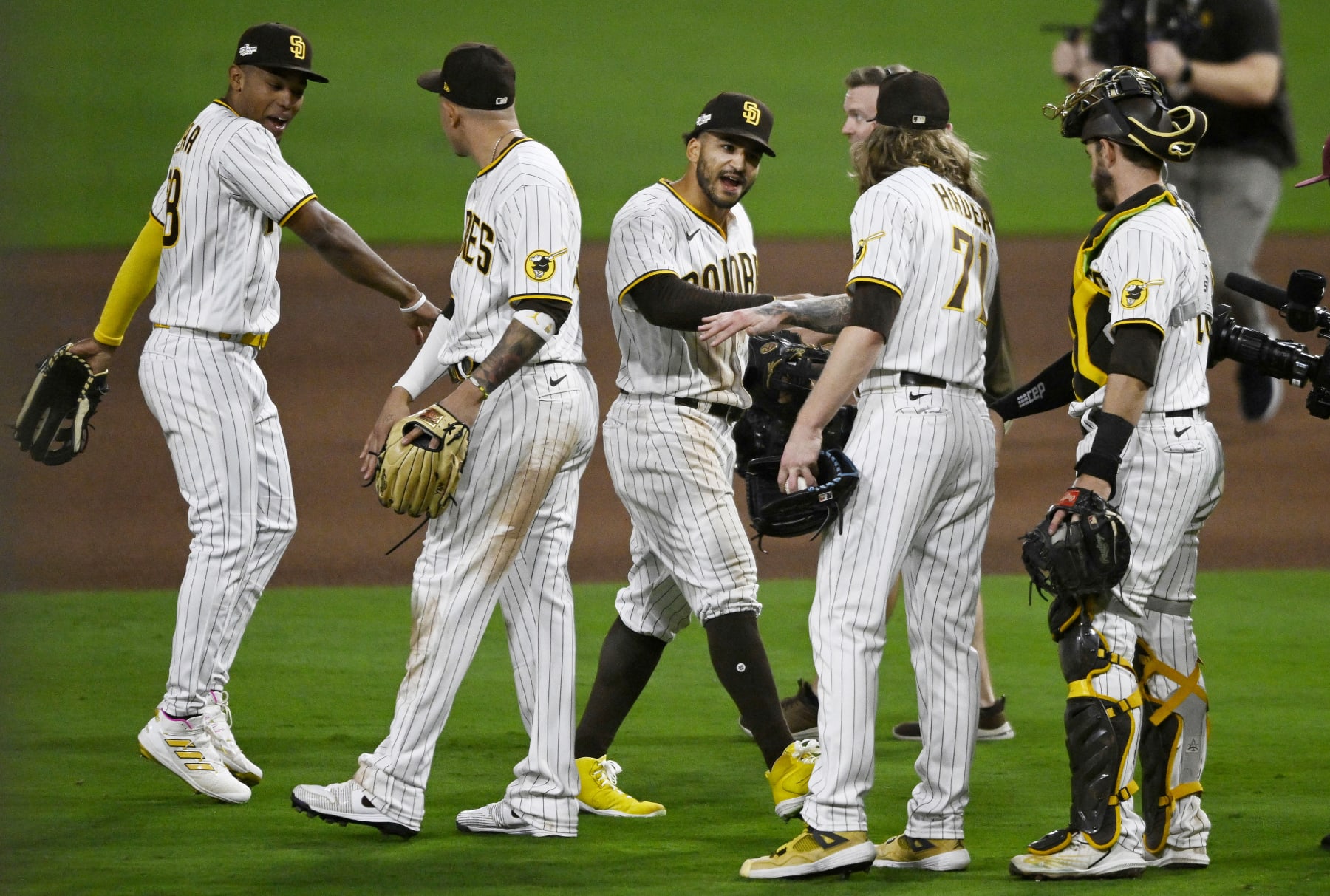 SAN DIEGO, CALIFORNIA - OCTOBER 14: Trent Grisham #2 of the San Diego Padres celebrates with teammates after defeating the Los Angeles Dodgers in game three of the National League Division Series at PETCO Park on October 14, 2022 in San Diego, California. (Photo by Denis Poroy/Getty Images)