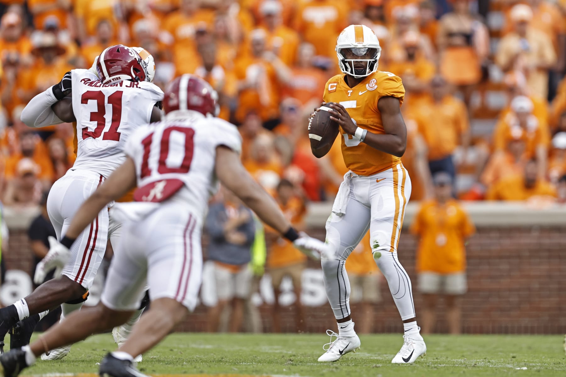 Tennessee quarterback Hendon Hooker (5) looks for a receiver during the first half of an NCAA college football game against Alabama Saturday, Oct. 15, 2022, in Knoxville, Tenn. (AP Photo/Wade Payne)