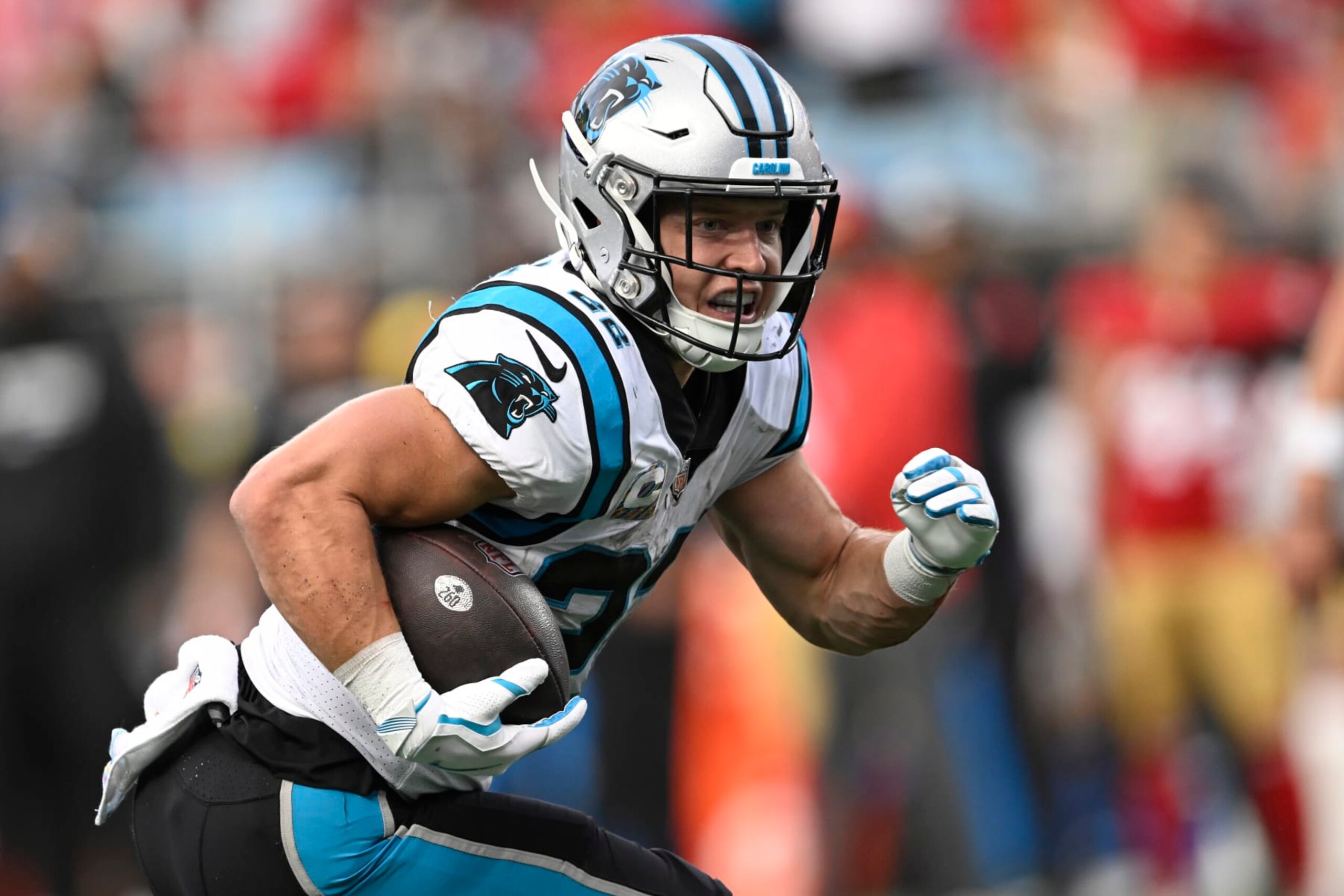 CHARLOTTE, NORTH CAROLINA - OCTOBER 09: Christian McCaffrey #22 of the Carolina Panthers runs the ball for a touchdown during the second half in the game against the San Francisco 49ers at Bank of America Stadium on October 09, 2022 in Charlotte, North Carolina. (Photo by Eakin Howard/Getty Images)