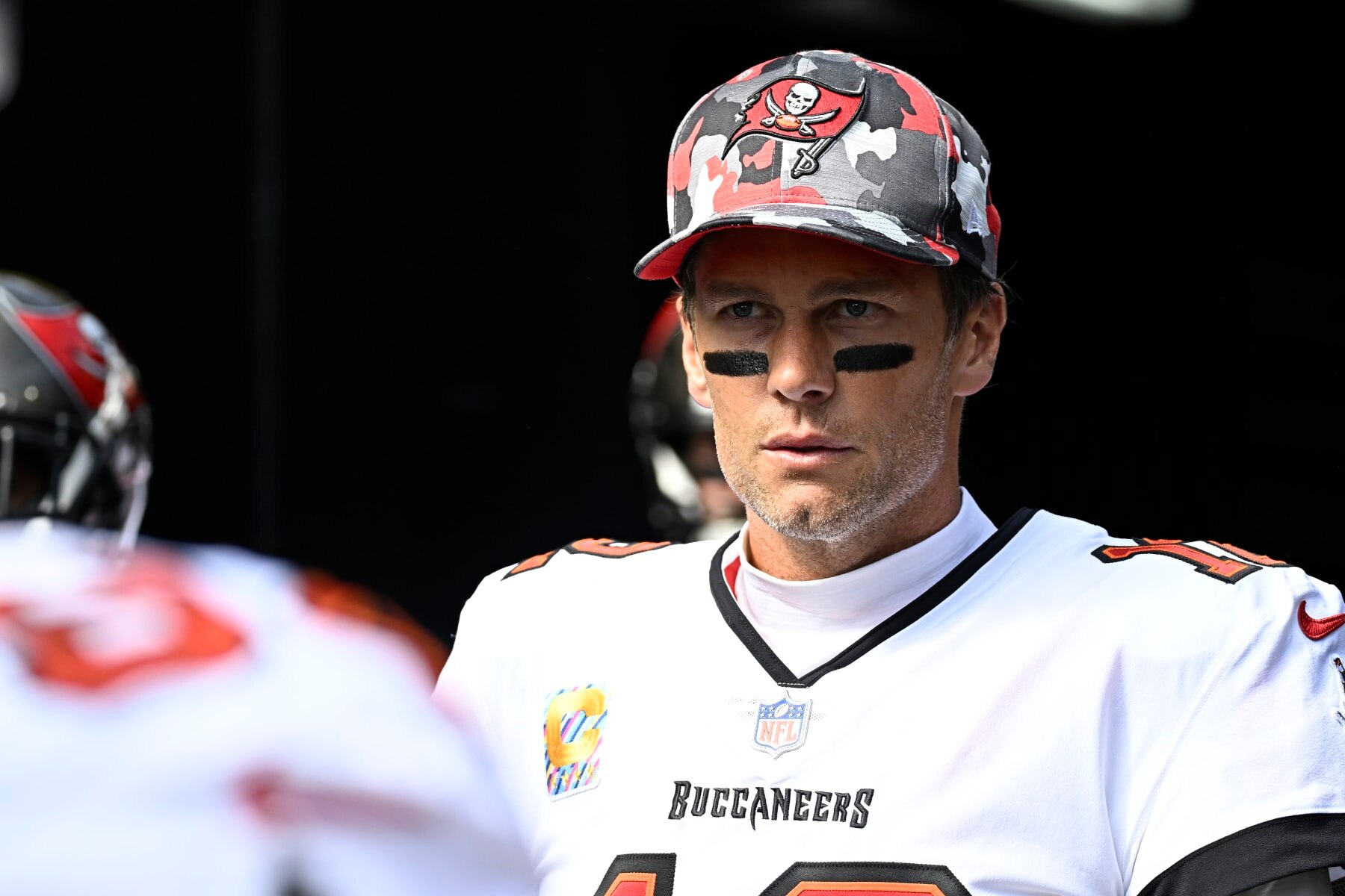 PITTSBURGH, PA - OCTOBER 16:   Tampa Bay Buccaneers quarterback Tom Brady (12) looks on to the field as he enters from the tunnel during the game between the Tampa Bay Buccaneers and the Pittsburgh Steelers at Acrisure Stadium in Pittsburgh, PA on October 16, 2022.  (Photo by Shelley Lipton/Icon Sportswire via Getty Images)