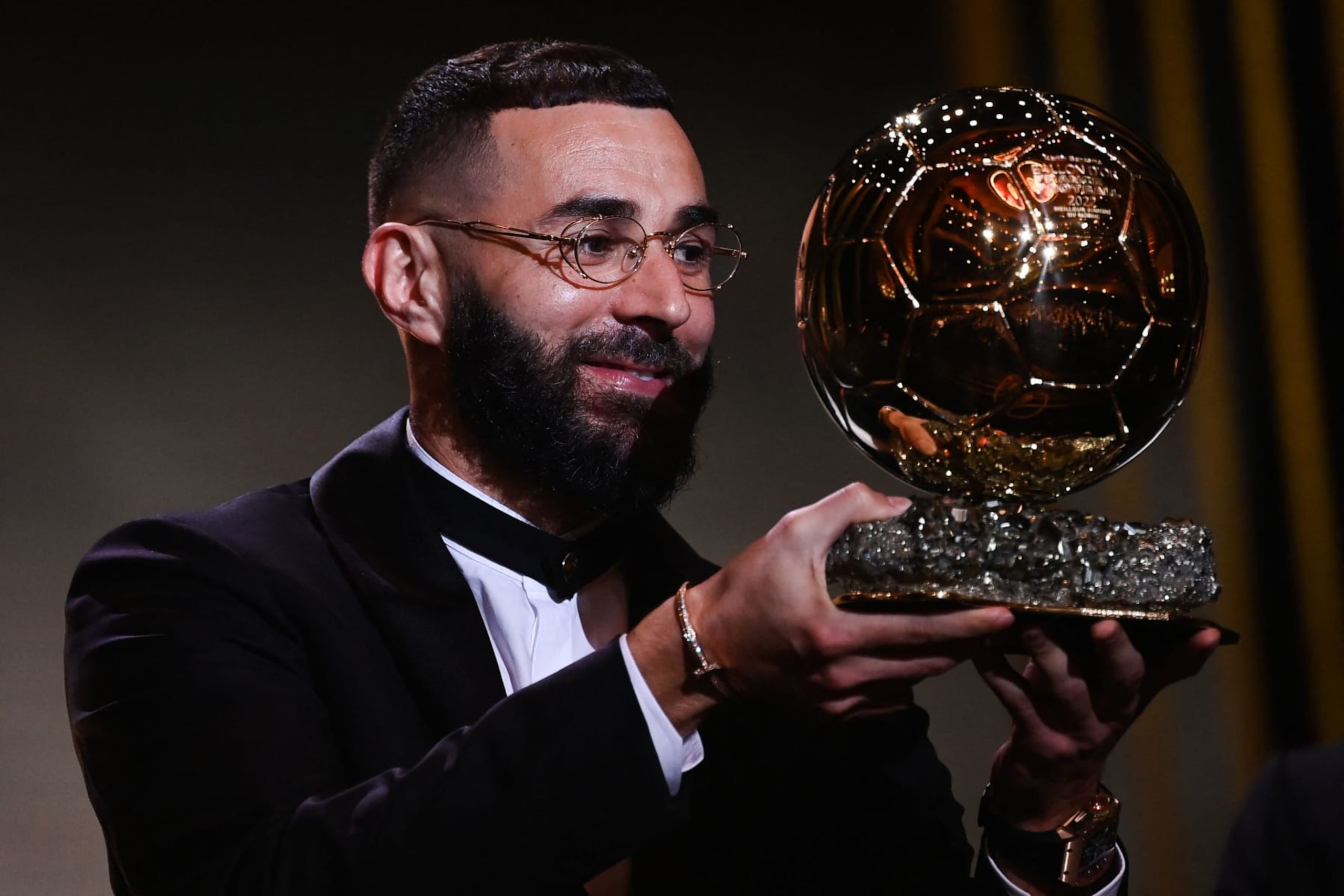 Real Madrid's French forward Karim Benzema receives the Ballon d'Or award during the 2022 Ballon d'Or France Football award ceremony at the Theatre du Chatelet in Paris on October 17, 2022. (Photo by FRANCK FIFE / AFP) (Photo by FRANCK FIFE/AFP via Getty Images)