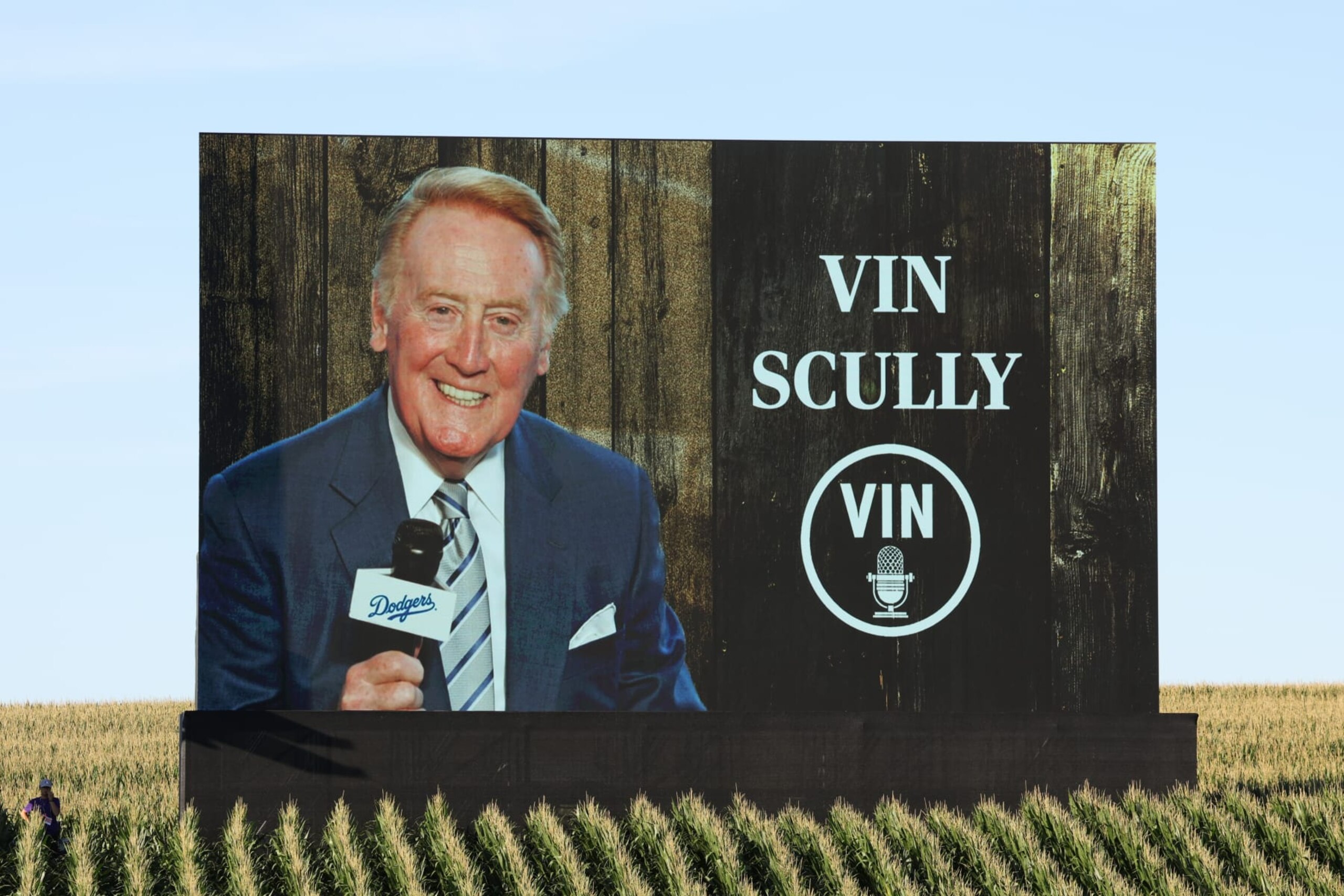 DYERSVILLE, IA - AUGUST 11: Detail shot of the LED video board featuring a photo of Vin Scully prior to the game between the Chicago Cubs and the Cincinnati Reds at The MLB Field at Field of Dreams on Thursday, August 11, 2022 in Dyersville, Iowa. (Photo by Mary DeCicco/MLB Photos via Getty Images)