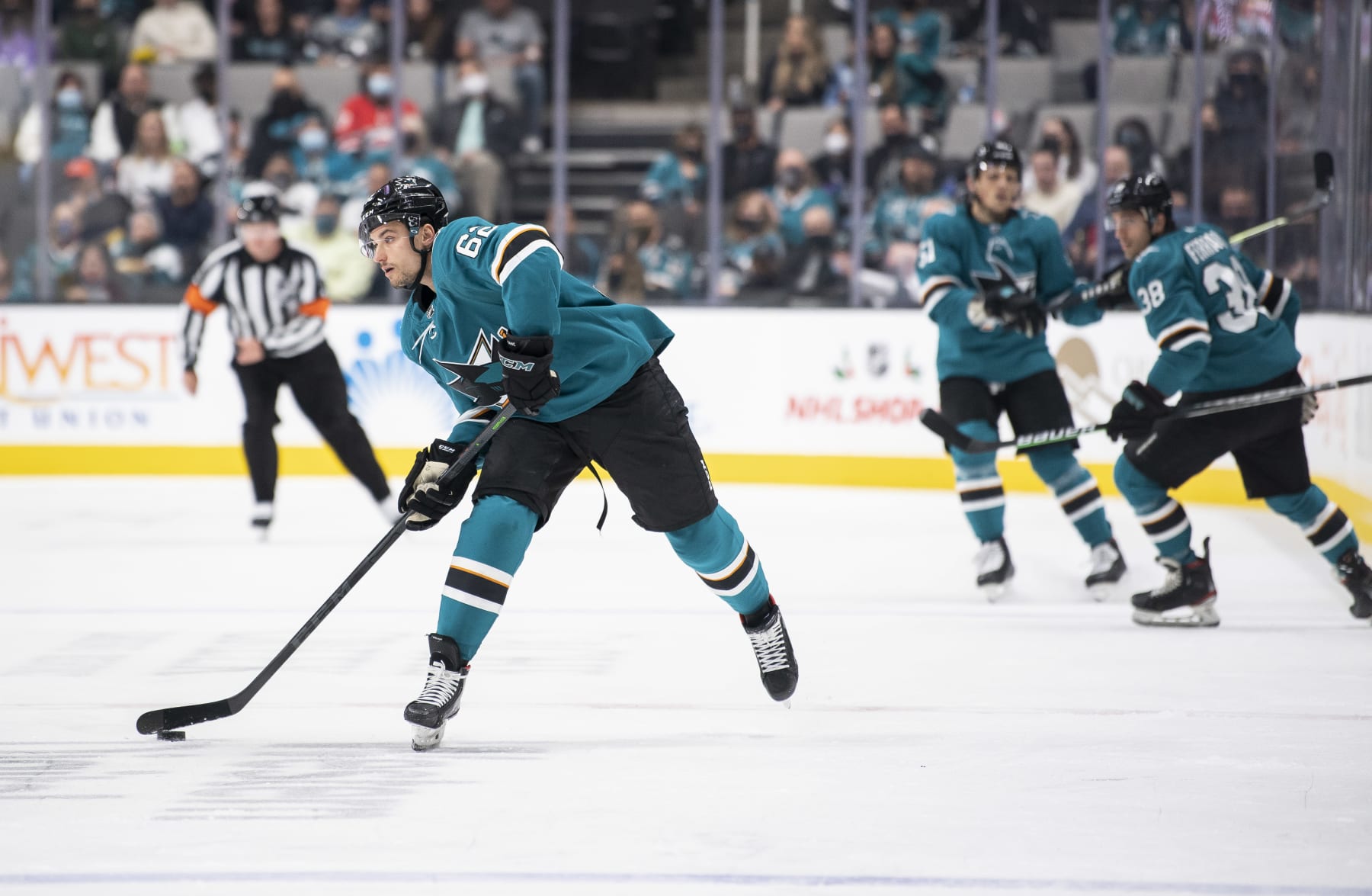 SAN JOSE, CA - NOVEMBER 22: Kevin Labanc #62 of the San Jose Sharks passes the puck ahead against the Carolina Hurricanes in a regular season game at SAP Center on November 22, 2021 in San Jose, California. (Photo by Amanda Cain/NHLI)