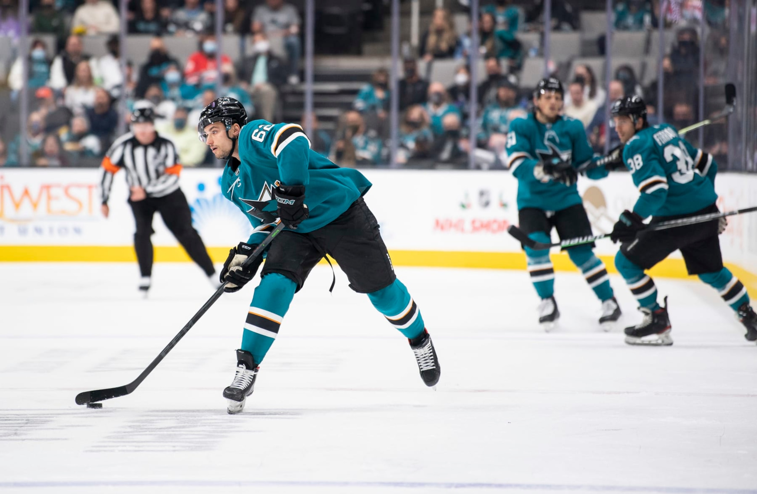 SAN JOSE, CA - NOVEMBER 22: Kevin Labanc #62 of the San Jose Sharks passes the puck ahead against the Carolina Hurricanes in a regular season game at SAP Center on November 22, 2021 in San Jose, California. (Photo by Amanda Cain/NHLI)