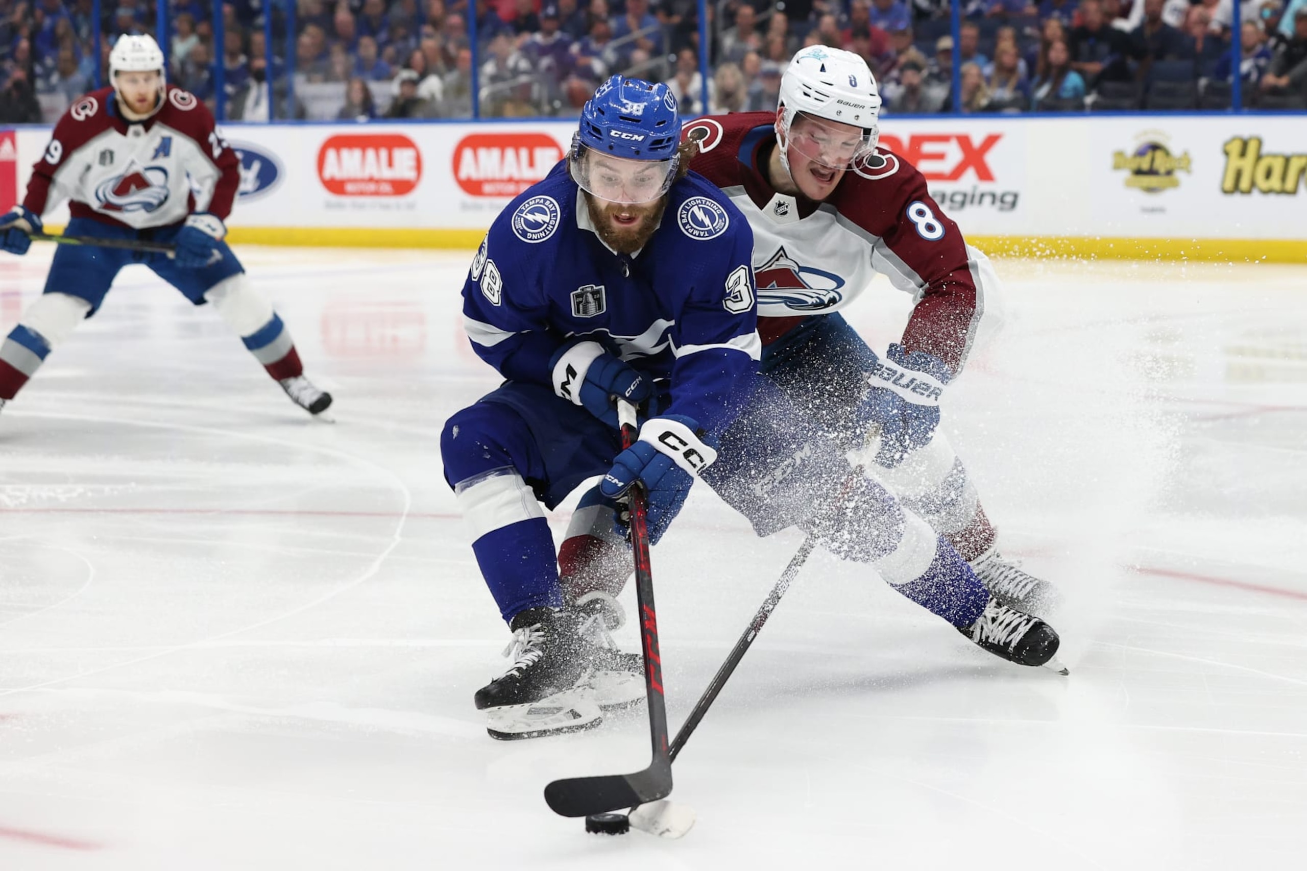 TAMPA, FLORIDA - JUNE 26: Brandon Hagel #38 of the Tampa Bay Lightning skates with the puck as Cale Makar #8 of the Colorado Avalanche defends in the second period of the game in Game Six of the 2022 NHL Stanley Cup Final at Amalie Arena on June 26, 2022 in Tampa, Florida. (Photo by Mike Carlson/Getty Images)