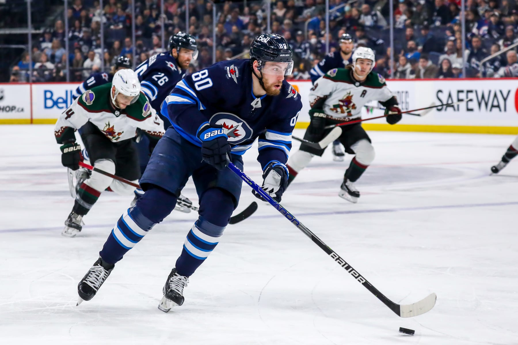 WINNIPEG, MB - MARCH 27: Pierre-Luc Dubois #80 of the Winnipeg Jets plays the puck during first period action against the Arizona Coyotes at Canada Life Centre on March 27, 2022 in Winnipeg, Manitoba, Canada. (Photo by Darcy Finley/NHLI via Getty Images)