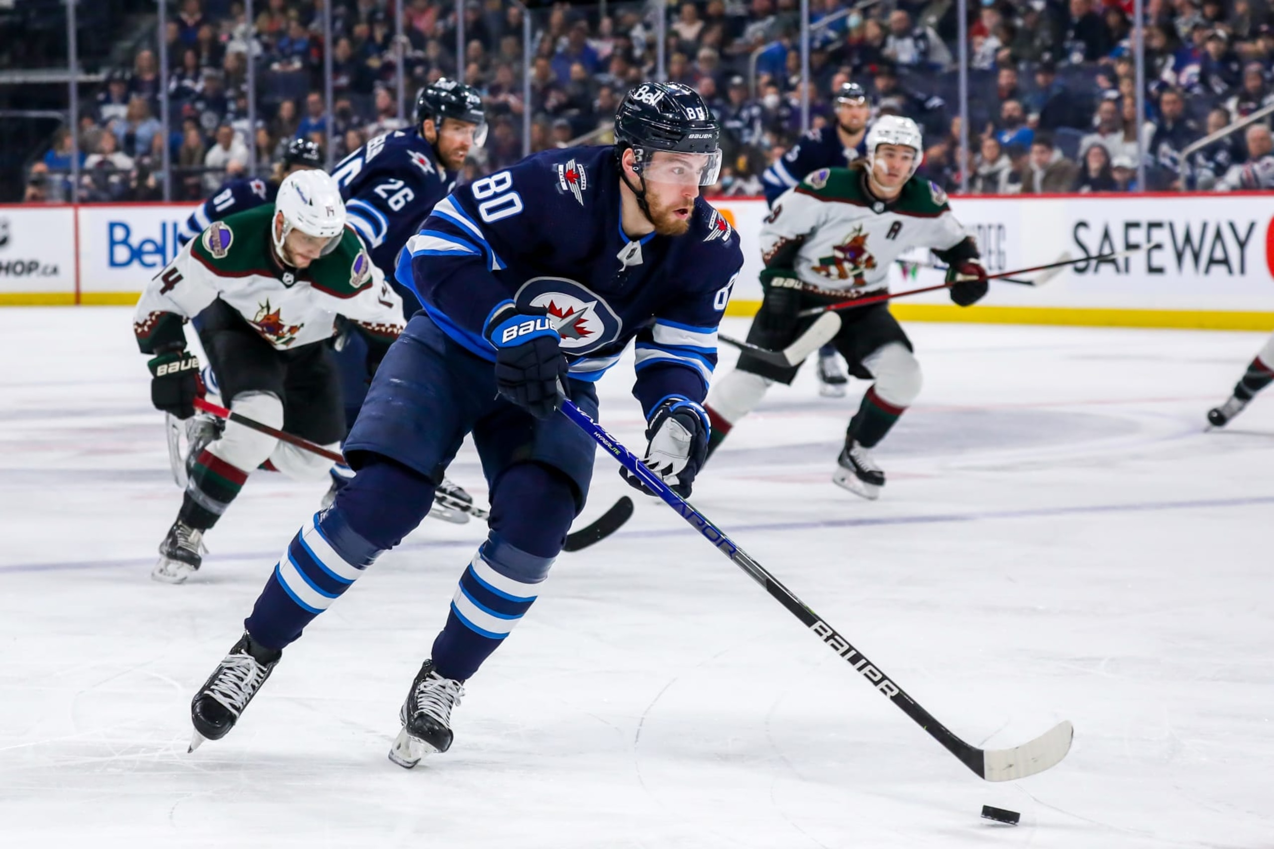 WINNIPEG, MB - MARCH 27: Pierre-Luc Dubois #80 of the Winnipeg Jets plays the puck during first period action against the Arizona Coyotes at Canada Life Centre on March 27, 2022 in Winnipeg, Manitoba, Canada. (Photo by Darcy Finley/NHLI via Getty Images)