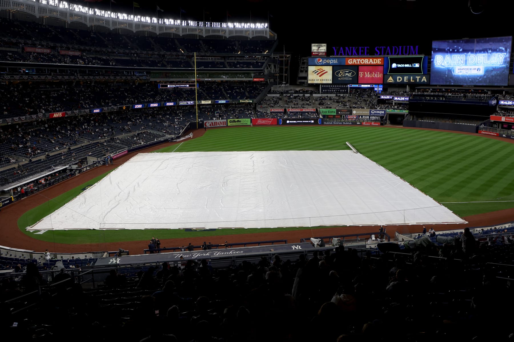 NEW YORK, NEW YORK - OCTOBER 17: A tarp covers the infield prior to game five of the American League Division Series between the Cleveland Guardians and New York Yankees at Yankee Stadium on October 17, 2022 in New York, New York. (Photo by Al Bello/Getty Images)