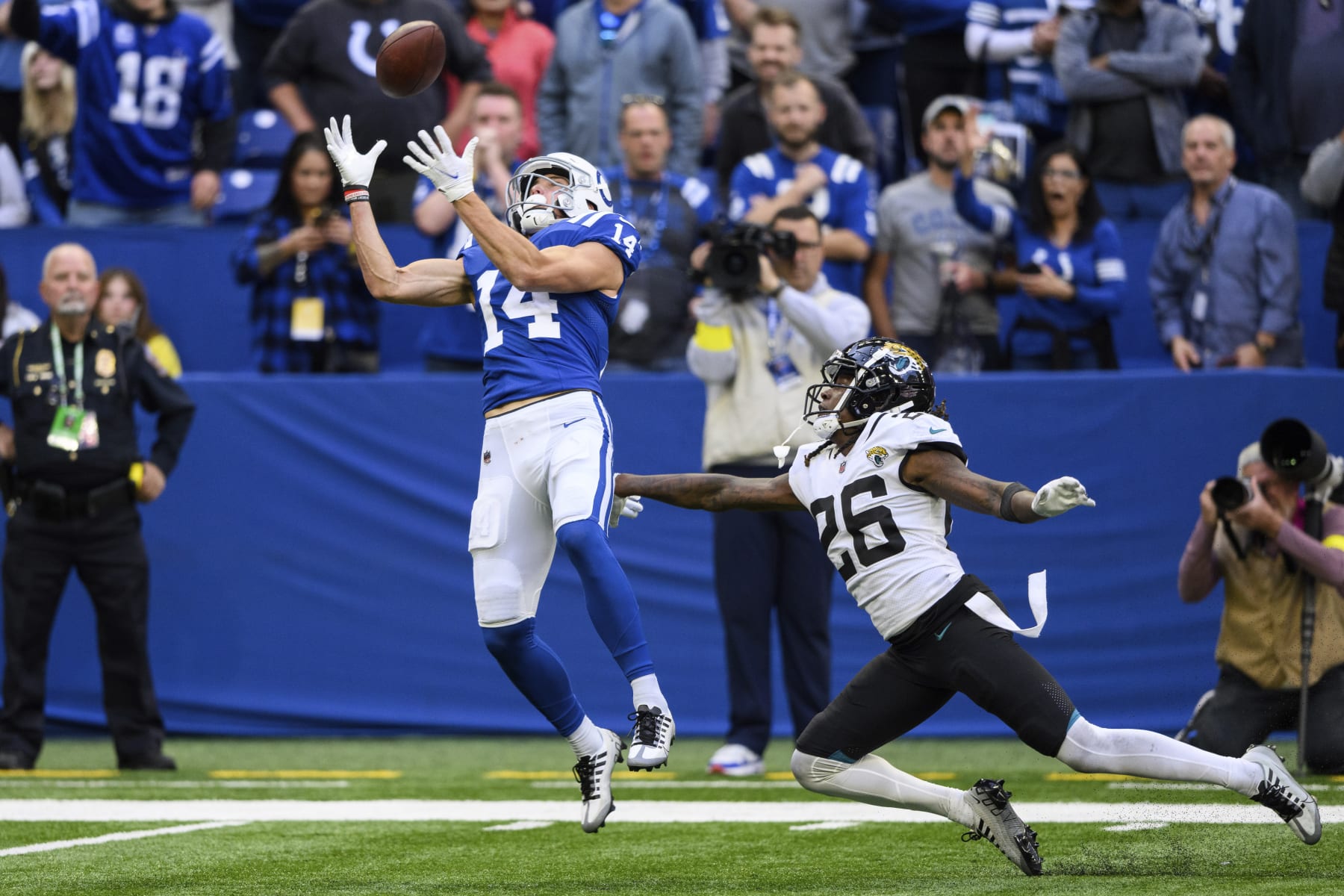 Indianapolis Colts wide receiver Alec Pierce (14) catches the game winning touchdown pass against Jacksonville Jaguars cornerback Shaquill Griffin (26) during an NFL football game, Sunday, Oct. 16, 2022, in Indianapolis. (AP Photo/Zach Bolinger)