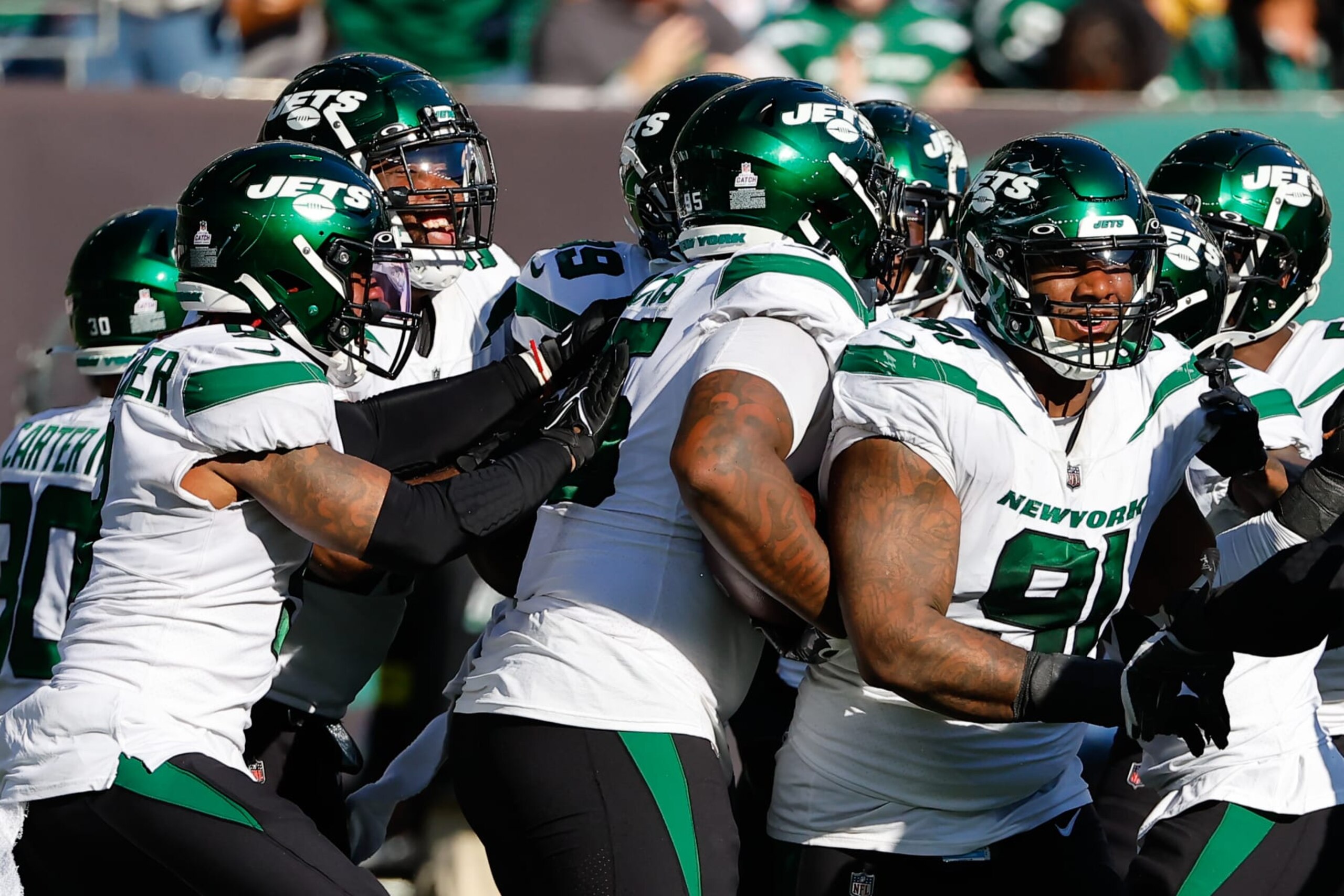 EAST RUTHERFORD, NJ - OCTOBER 09:  New York Jets defensive tackle Quinnen Williams (95) celebrates with teammates after recovering a fumble  during the National Football League game between the New York Jets and Miami Dolphins on October 9, 2022 at MetLife Stadium in East Rutherford, New Jersey.(Photo by Rich Graessle/Icon Sportswire via Getty Images)