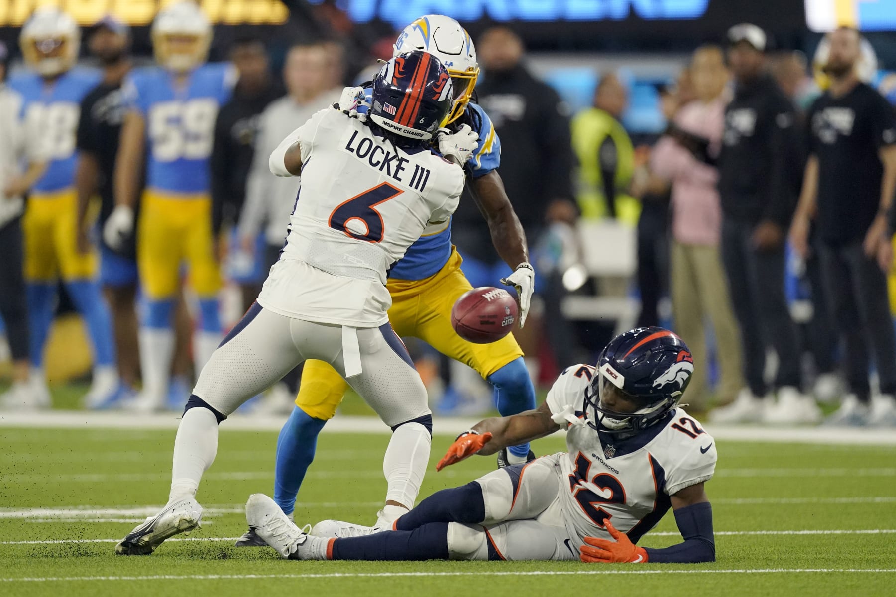 Denver Broncos wide receiver Montrell Washington (12) misses a punt by the Los Angeles Chargers during the second half of an NFL football game, Monday, Oct. 17, 2022, in Inglewood, Calif. The Chargers recovered the ball. (AP Photo/Mark J. Terrill)