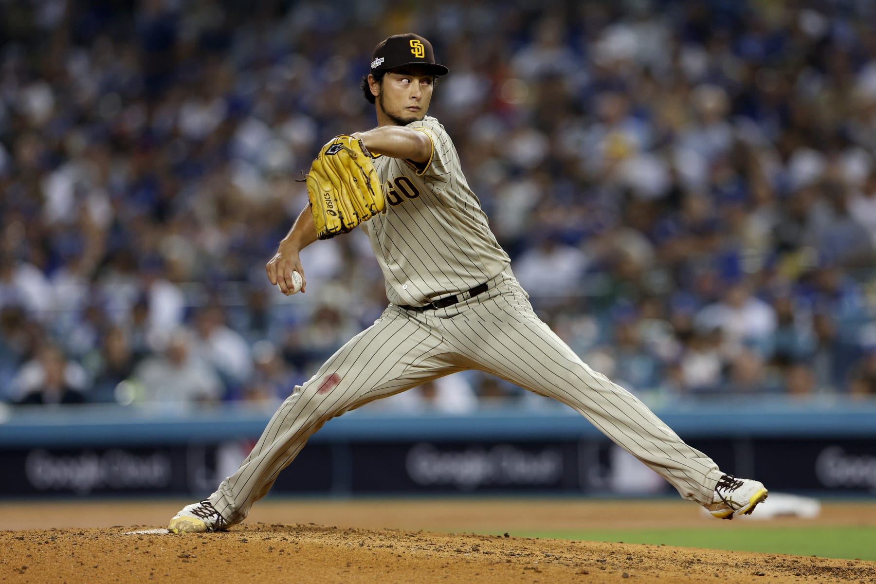 LOS ANGELES, CALIFORNIA - OCTOBER 12: Yu Darvish #11 of the San Diego Padres pitches in the fifth inning in game two of the National League Division Series against the Los Angeles Dodgers at Dodger Stadium on October 12, 2022 in Los Angeles, California. (Photo by Harry How/Getty Images) LOS ANGELES, CALIFORNIA - OCTOBER 12: Yu Darvish #11 of the San Diego Padres pitches in the fifth inning in game two of the National League Division Series against the Los Angeles Dodgers at Dodger Stadium on October 12, 2022 in Los Angeles, California. (Photo by Harry How/Getty Images)