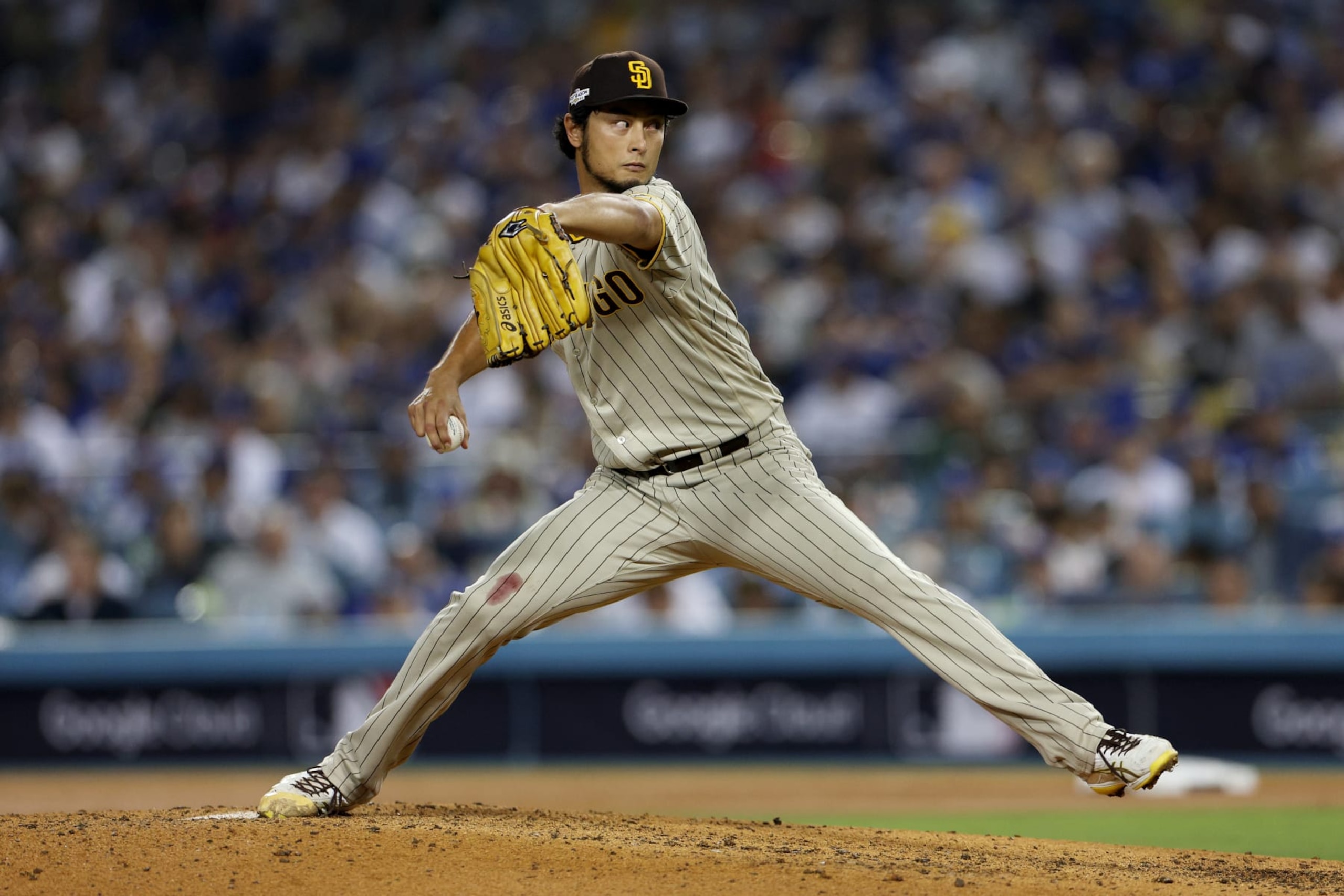 LOS ANGELES, CALIFORNIA - OCTOBER 12: Yu Darvish #11 of the San Diego Padres pitches in the fifth inning in game two of the National League Division Series against the Los Angeles Dodgers at Dodger Stadium on October 12, 2022 in Los Angeles, California. (Photo by Harry How/Getty Images)