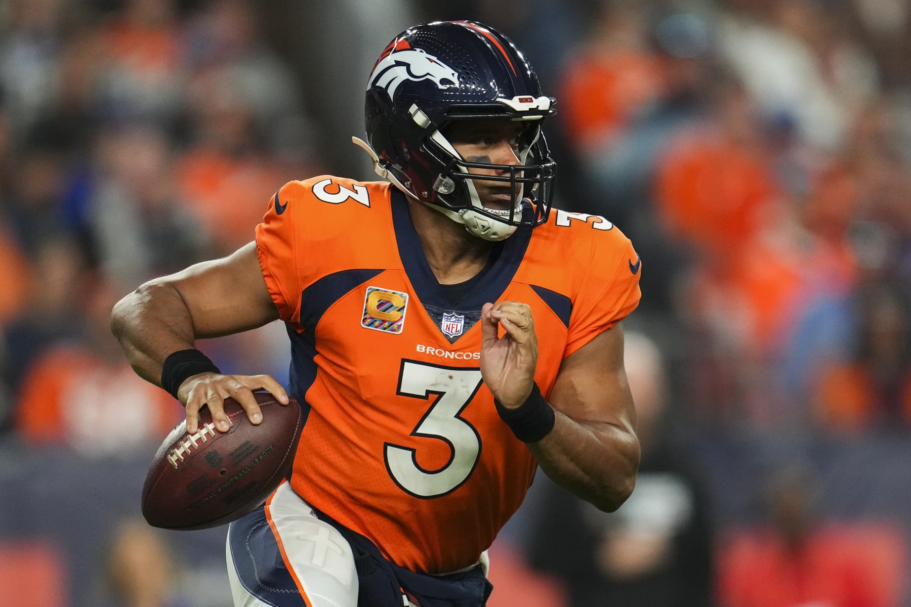 DENVER, CO - OCTOBER 06: Russell Wilson #3 of the Denver Broncos scrambles against the Indianapolis Colts at Empower Field at Mile High on October 6, 2022 in Denver, Texas. (Photo by Cooper Neill/Getty Images)