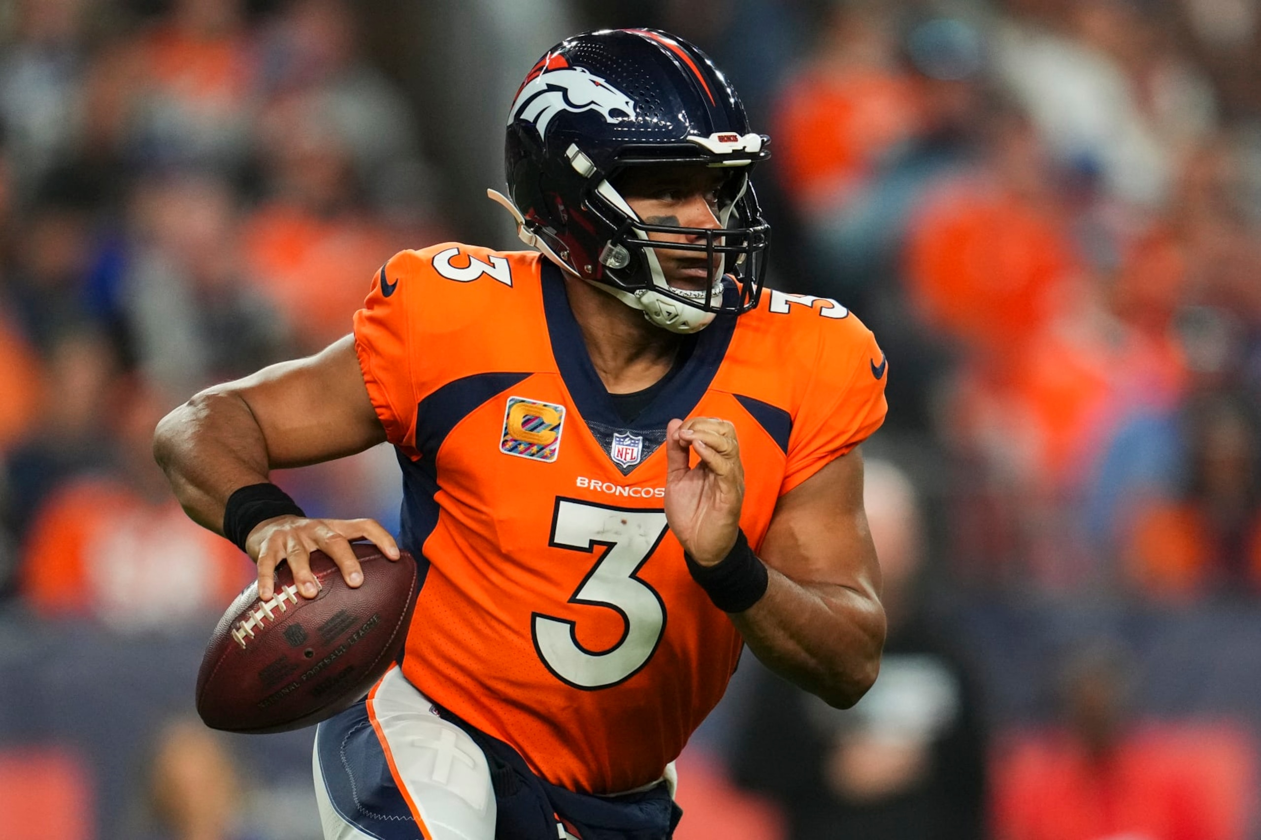 DENVER, CO - OCTOBER 06: Russell Wilson #3 of the Denver Broncos scrambles against the Indianapolis Colts at Empower Field at Mile High on October 6, 2022 in Denver, Texas. (Photo by Cooper Neill/Getty Images)