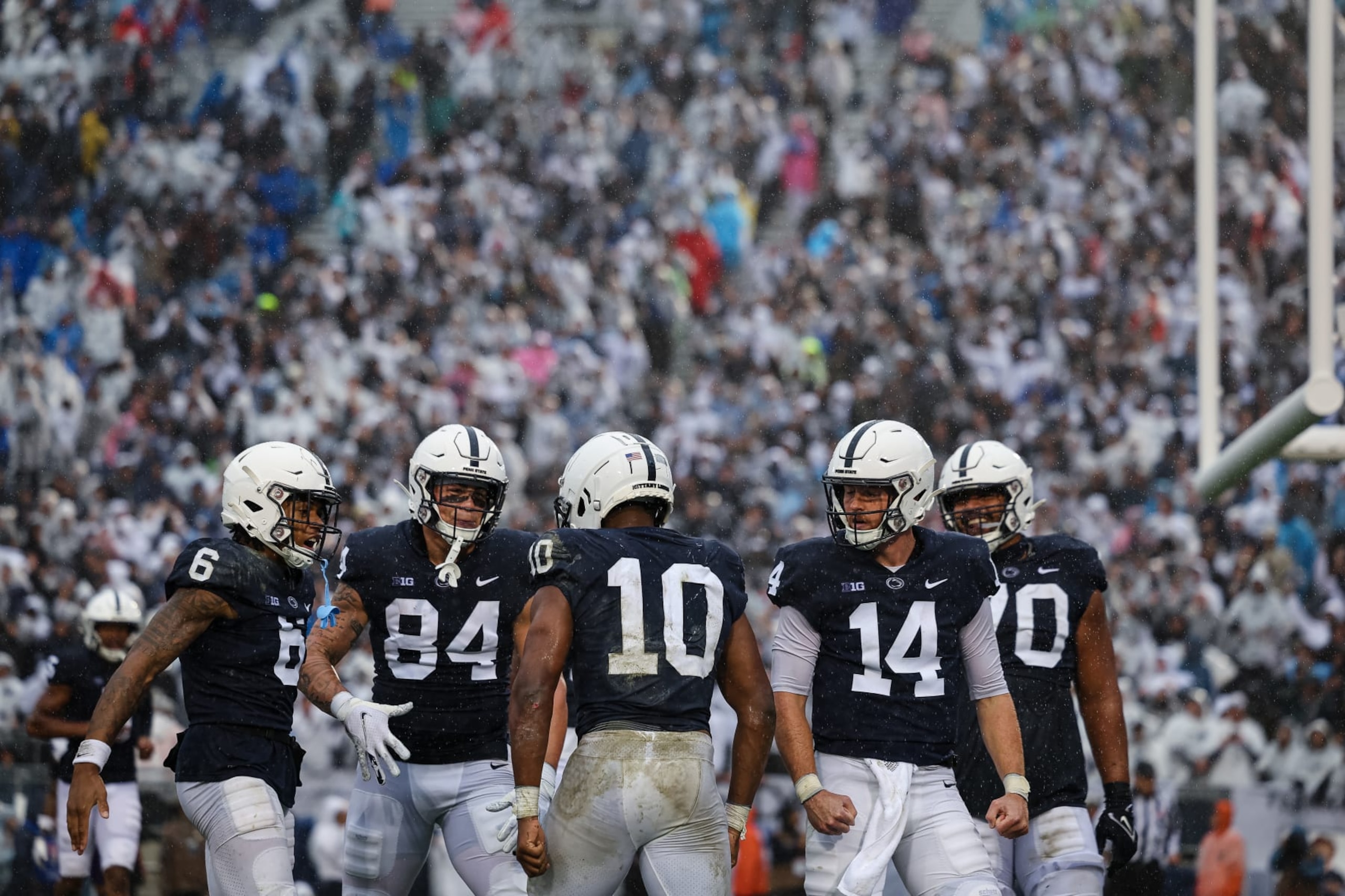 STATE COLLEGE, PA - OCTOBER 01: Nicholas Singleton #10 of the Penn State Nittany Lions celebrates with teammates after scoring a touchdown against the Northwestern Wildcats during the first half at Beaver Stadium on October 1, 2022 in State College, Pennsylvania. (Photo by Scott Taetsch/Getty Images)