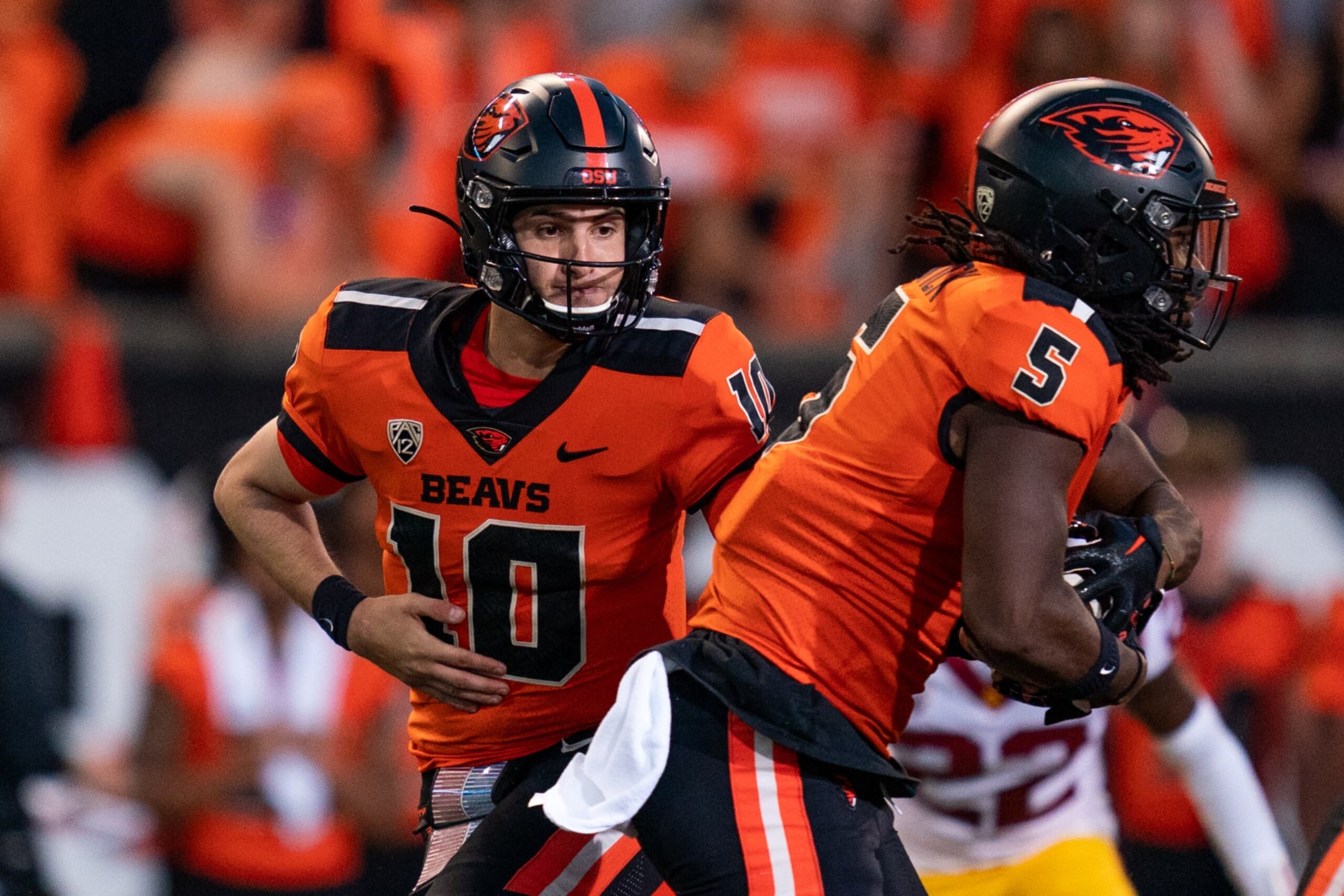 CORVALLIS, OR - SEPTEMBER 24: Quarterback Chance Nolan #10 of the Oregon State Beavers passes the ball to running back Deshaun Fenwick #5 against the USC Trojans at Reser Stadium on September 24, 2022 in Corvallis, Oregon. (Photo by Ali Gradischer/Getty Images)