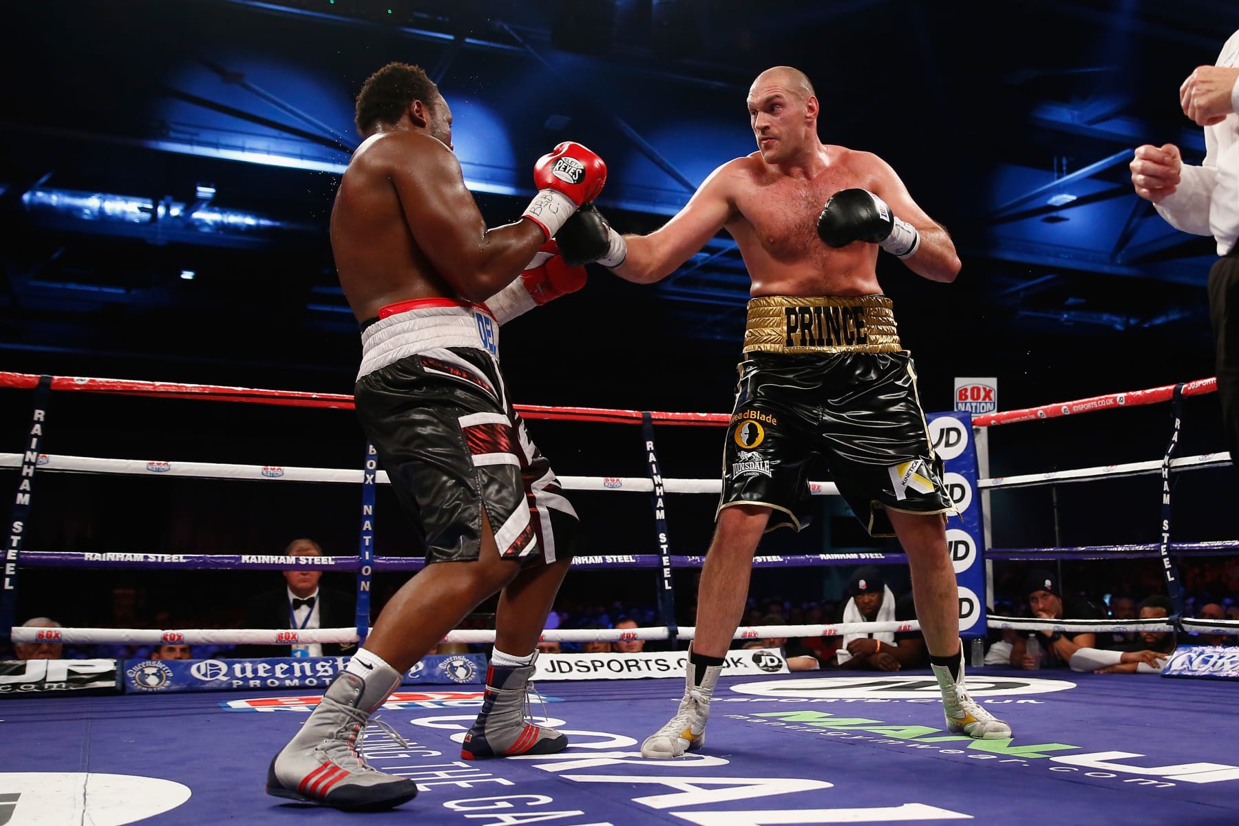 LONDON, ENGLAND - NOVEMBER 29:  Dereck Chisora of England fights Tyson Fury of England in the eliminator for the WBO World Heavyweight Championship during Boxing at ExCel on November 29, 2014 in London, England.  (Photo by Julian Finney/Getty Images)