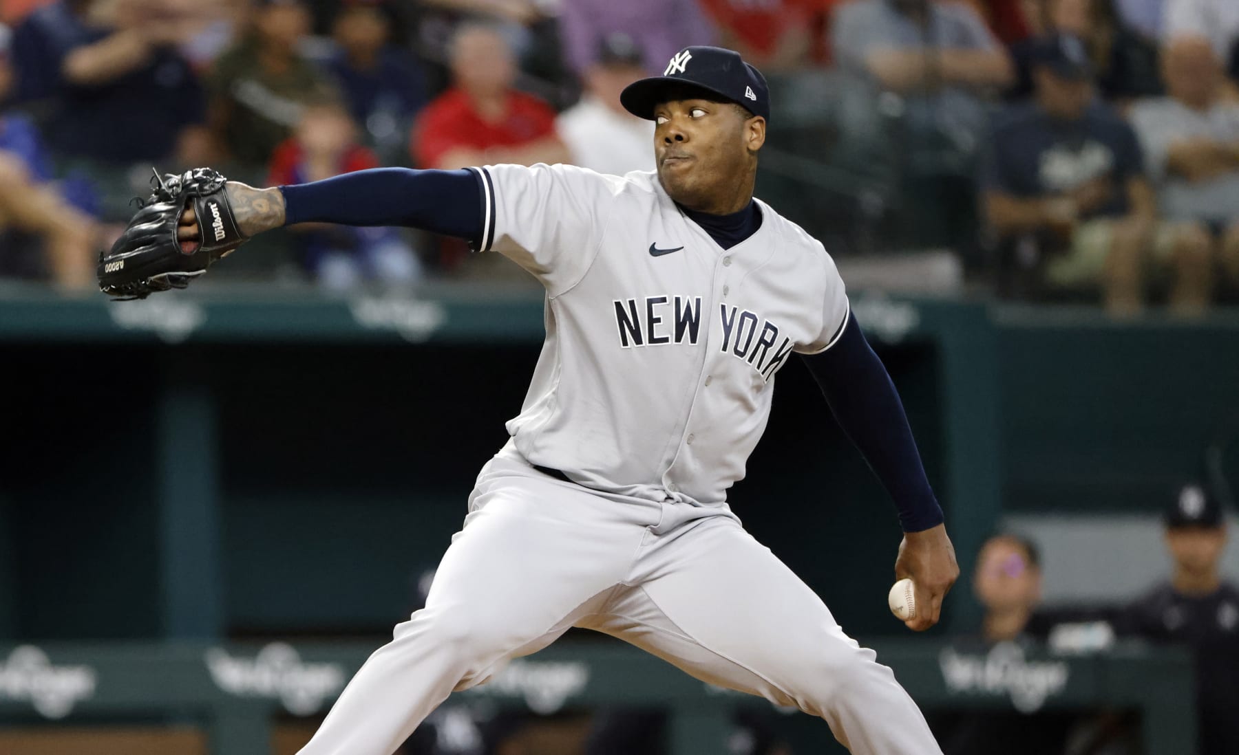 ARLINGTON, TX - OCTOBER 4: Aroldis Chapman #54 of the New York Yankees pitches against the Texas Rangers during the seventh inning in game one of a double header at Globe Life Field on October 4, 2022 in Arlington, Texas. (Photo by Ron Jenkins/Getty Images)