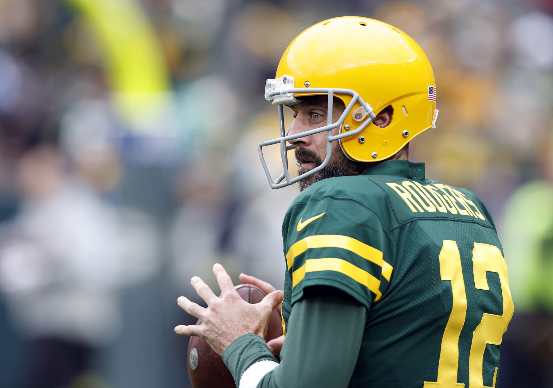 GREEN BAY, WISCONSIN - OCTOBER 16: Aaron Rodgers #12 of the Green Bay Packers warms up during pregame at Lambeau Field on October 16, 2022 in Green Bay, Wisconsin. (Photo by John Fisher/Getty Images)