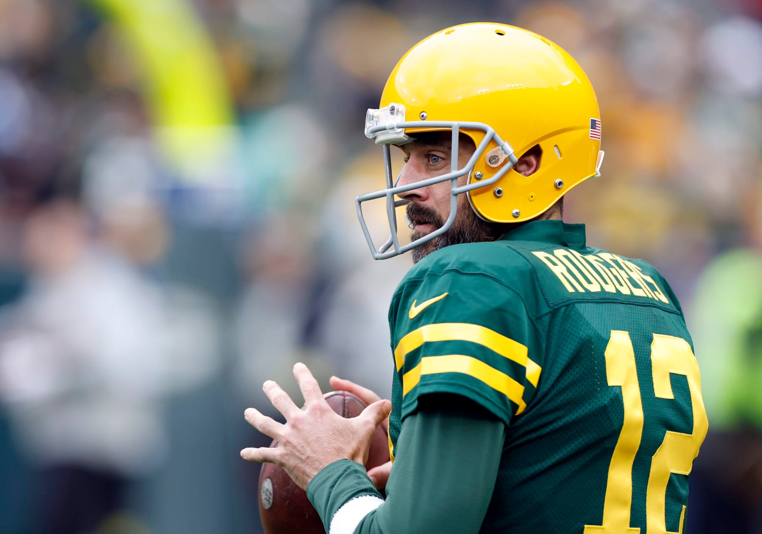 GREEN BAY, WISCONSIN - OCTOBER 16: Aaron Rodgers #12 of the Green Bay Packers warms up during pregame at Lambeau Field on October 16, 2022 in Green Bay, Wisconsin. (Photo by John Fisher/Getty Images)
