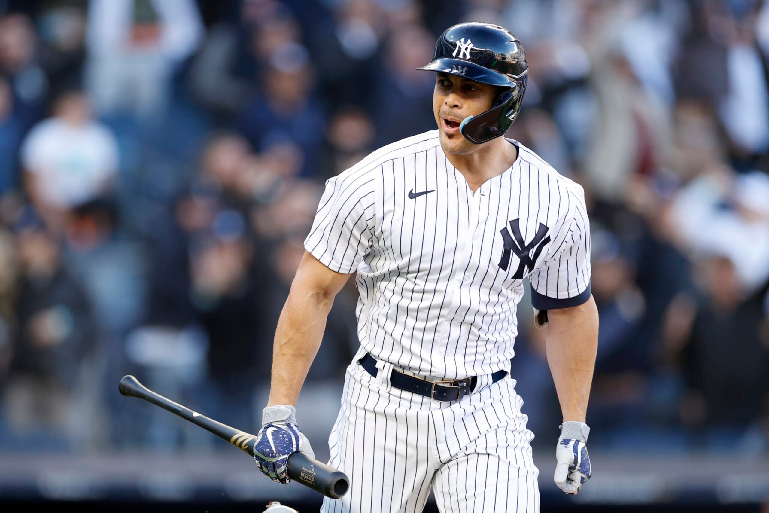 NEW YORK, NEW YORK - OCTOBER 18: Giancarlo Stanton #27 of the New York Yankees reacts after hitting a three-run home run against the Cleveland Guardians during the first inning in game five of the American League Division Series at Yankee Stadium on October 18, 2022 in New York, New York. (Photo by Sarah Stier/Getty Images)