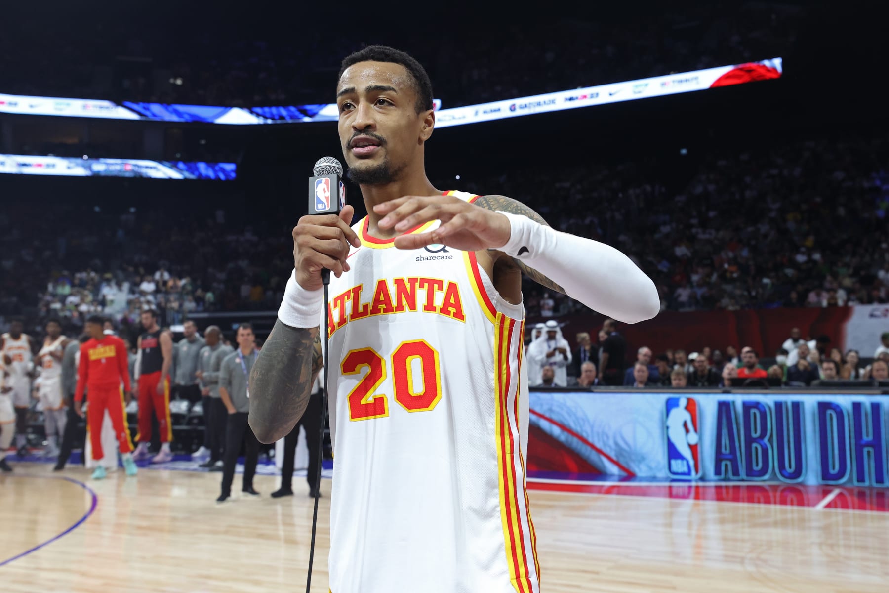 ABU DHABI, UAE - OCTOBER 8: John Collins #20 of the Atlanta Hawks talks to the crowd before the game against the Milwaukee Bucks as part of 2022 NBA Abu Dhabi Games at Etihad Arena on October 8, 2022 in Abu Dhabi, The United Arab Emirates. NOTE TO USER: User expressly acknowledges and agrees that, by downloading and/or using this Photograph, user is consenting to the terms and conditions of the Getty Images License Agreement. Mandatory Copyright Notice: Copyright 2022 NBAE (Photo by Joe Murphy/NBAE via Getty Images)
