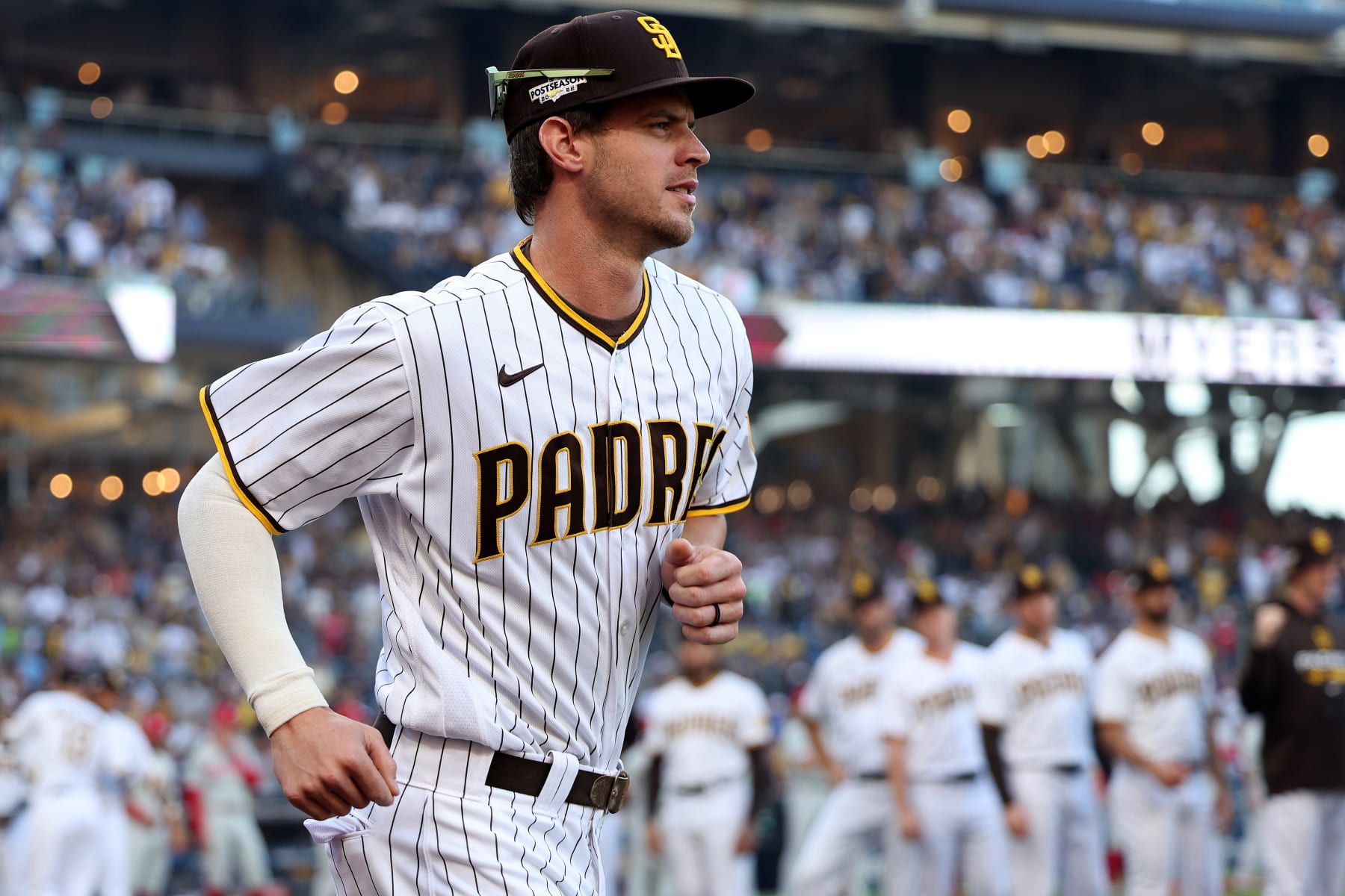 SAN DIEGO, CALIFORNIA - OCTOBER 18: Wil Myers #5 of the San Diego Padres runs onto the field during player introductions prior to game one of the National League Championship Series against the Philadelphia Phillies at PETCO Park on October 18, 2022 in San Diego, California. (Photo by Sean M. Haffey/Getty Images)