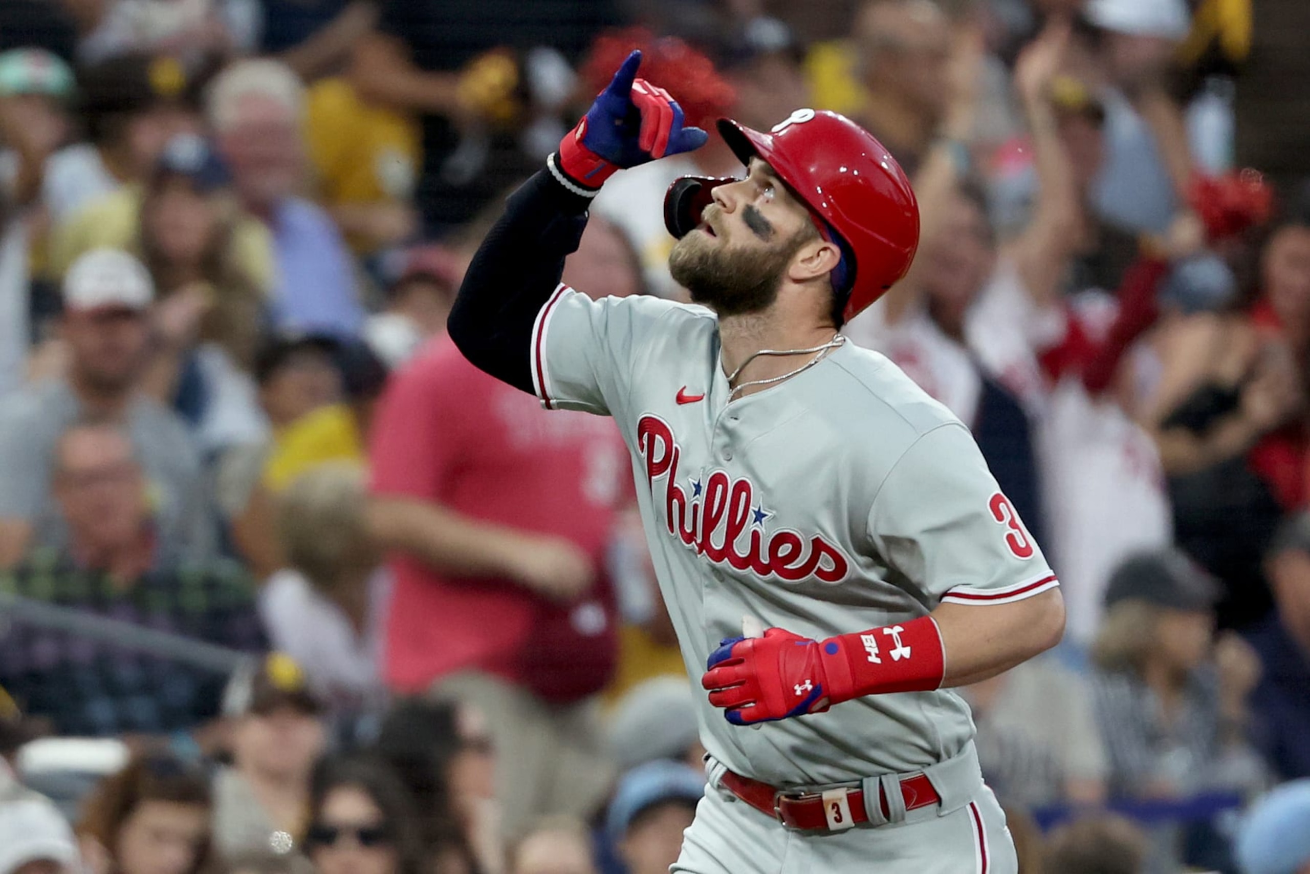 SAN DIEGO, CALIFORNIA - OCTOBER 18: Bryce Harper #3 of the Philadelphia Phillies reacts after hitting a home run during the fourth inning against the San Diego Padres in game one of the National League Championship Series at PETCO Park on October 18, 2022 in San Diego, California. (Photo by Sean M. Haffey/Getty Images)