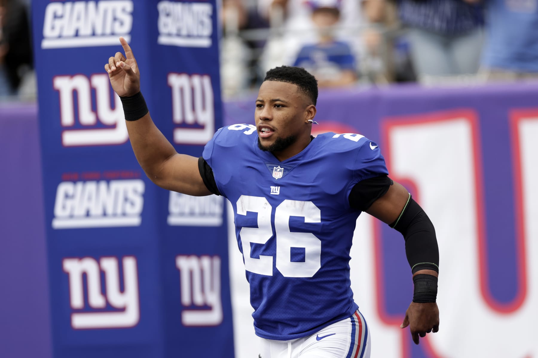 New York Giants running back Saquon Barkley (26) takes the field to face the Baltimore Ravens during an NFL football game Sunday, Oct. 16, 2022, in East Rutherford, N.J. (AP Photo/Adam Hunger)